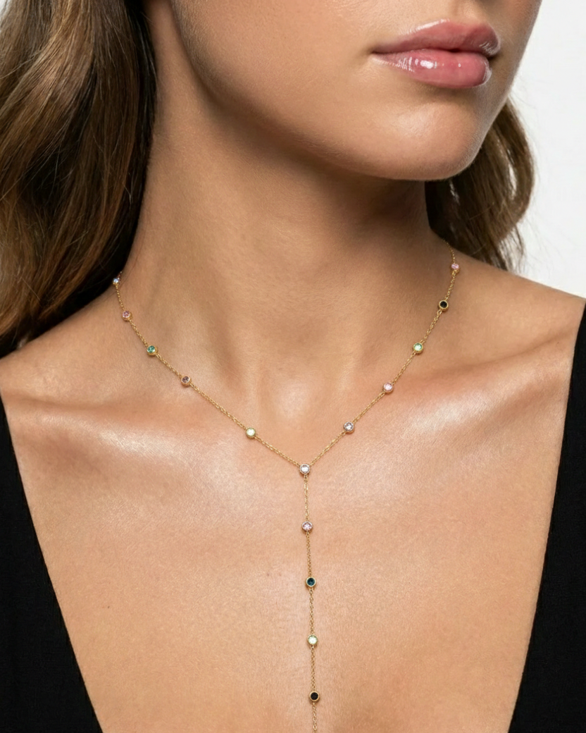Necklace with small beads on a model wearing a black top