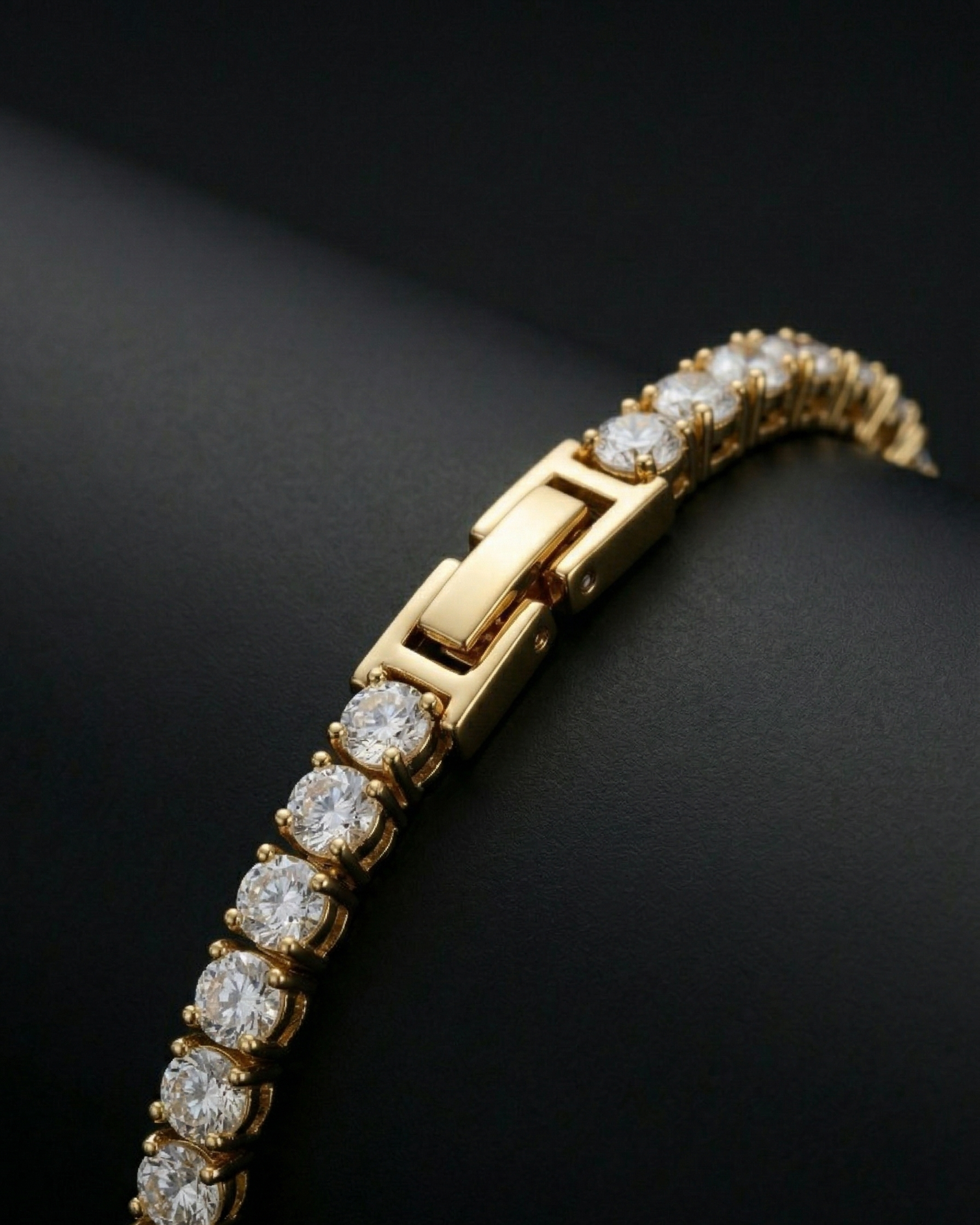 Gold bracelet with diamond stones on a dark background