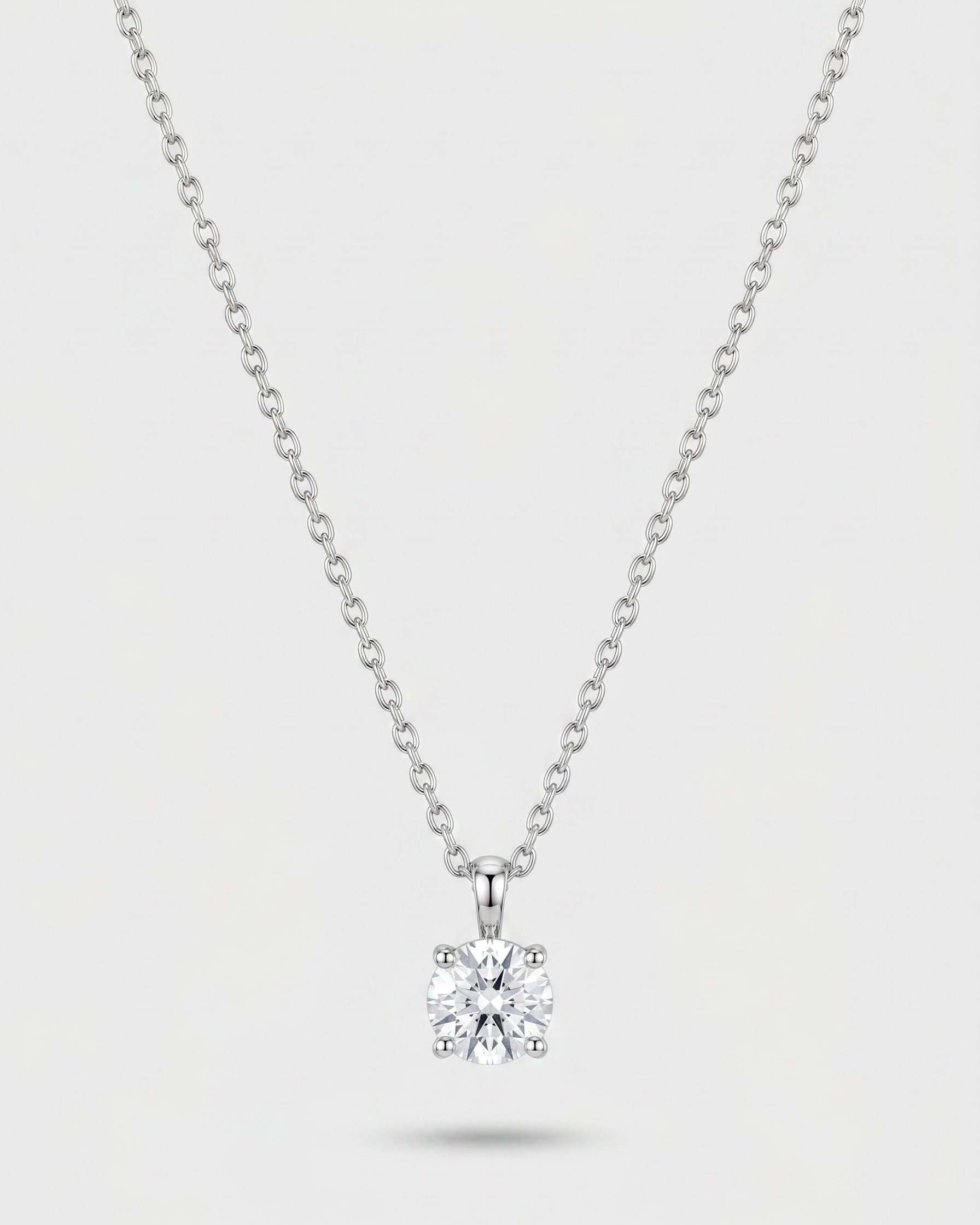 Diamond necklace on a light gray background
