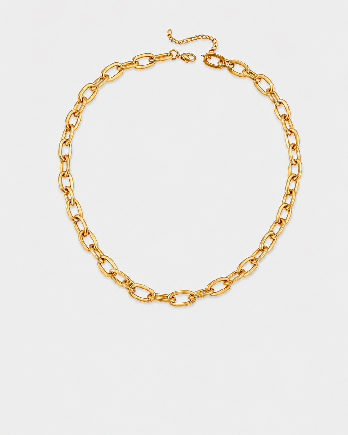 A gold-toned chunky chain link necklace with a lobster clasp and extender chain, displayed on a light gray background.
