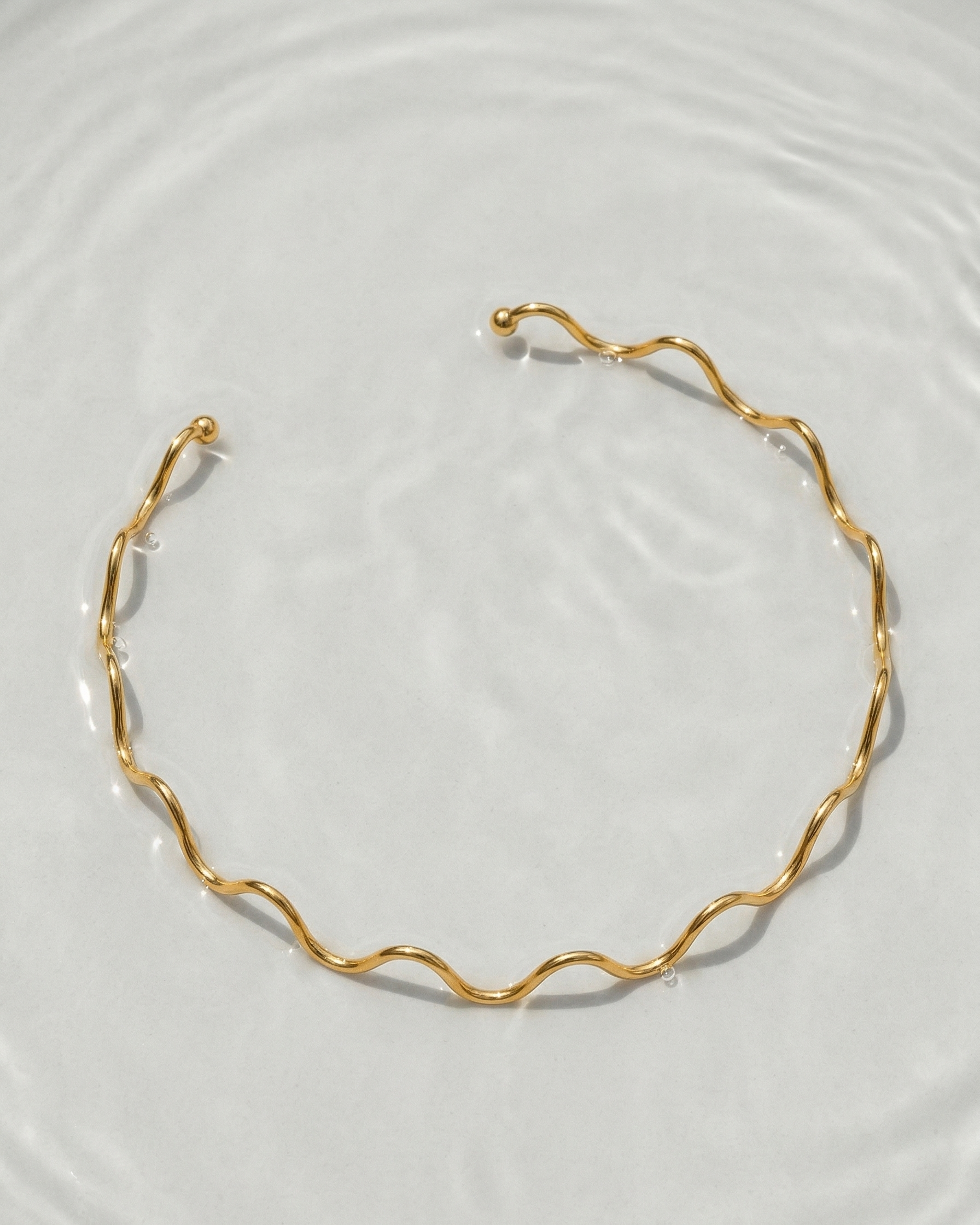 Gold necklace on a white background