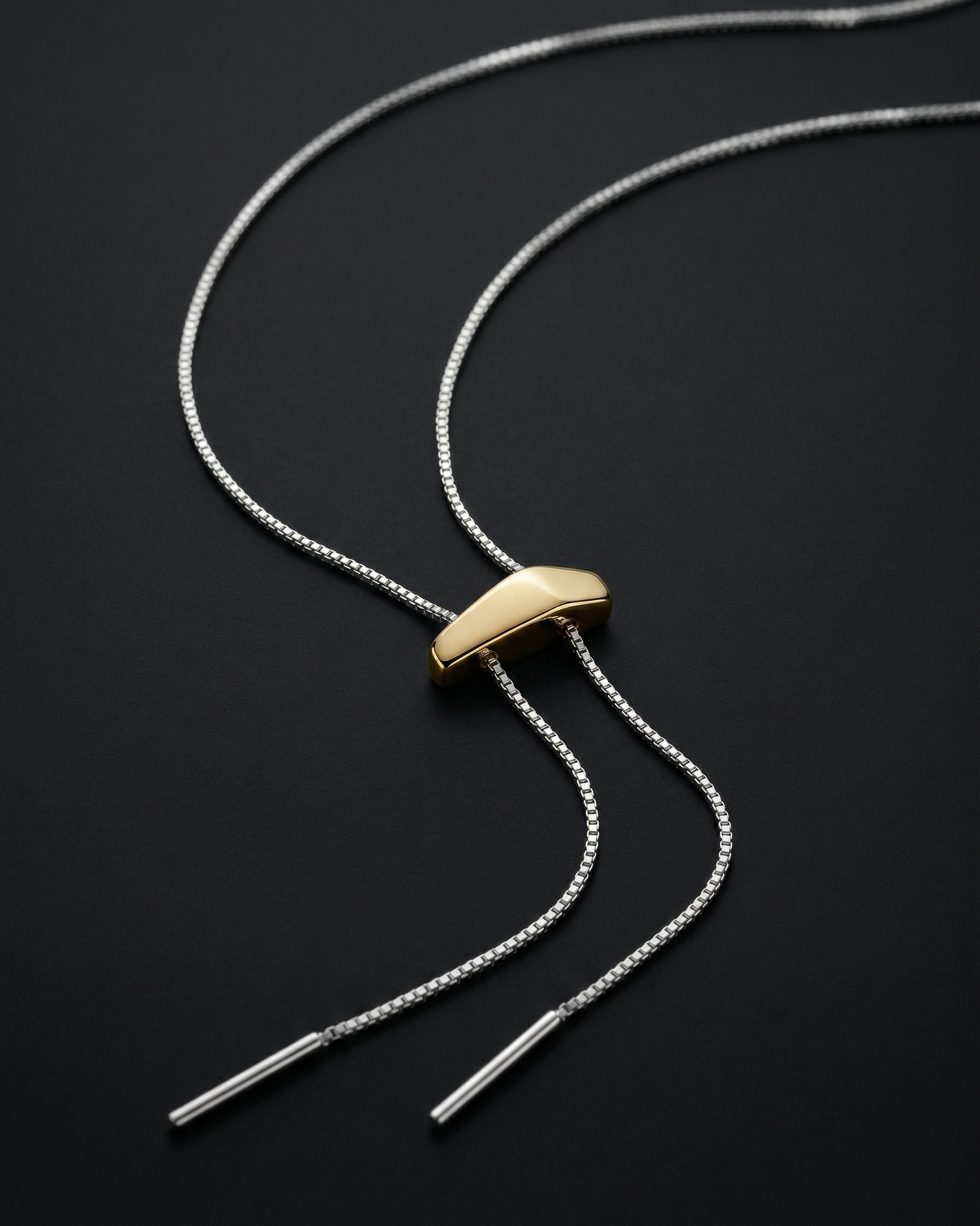 Necklace with a gold clasp on a black background