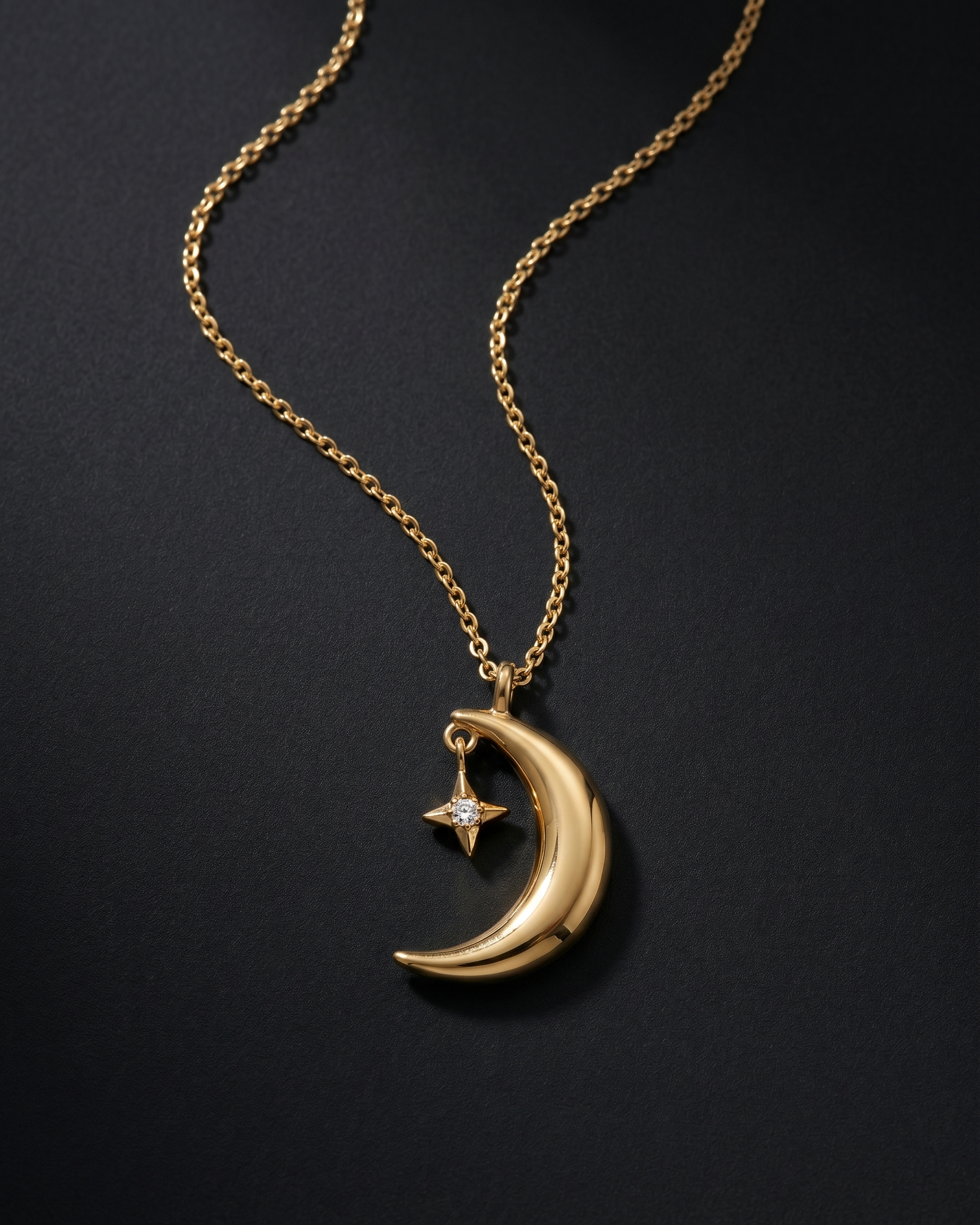 Gold necklace with a crescent moon and star pendant on a dark background