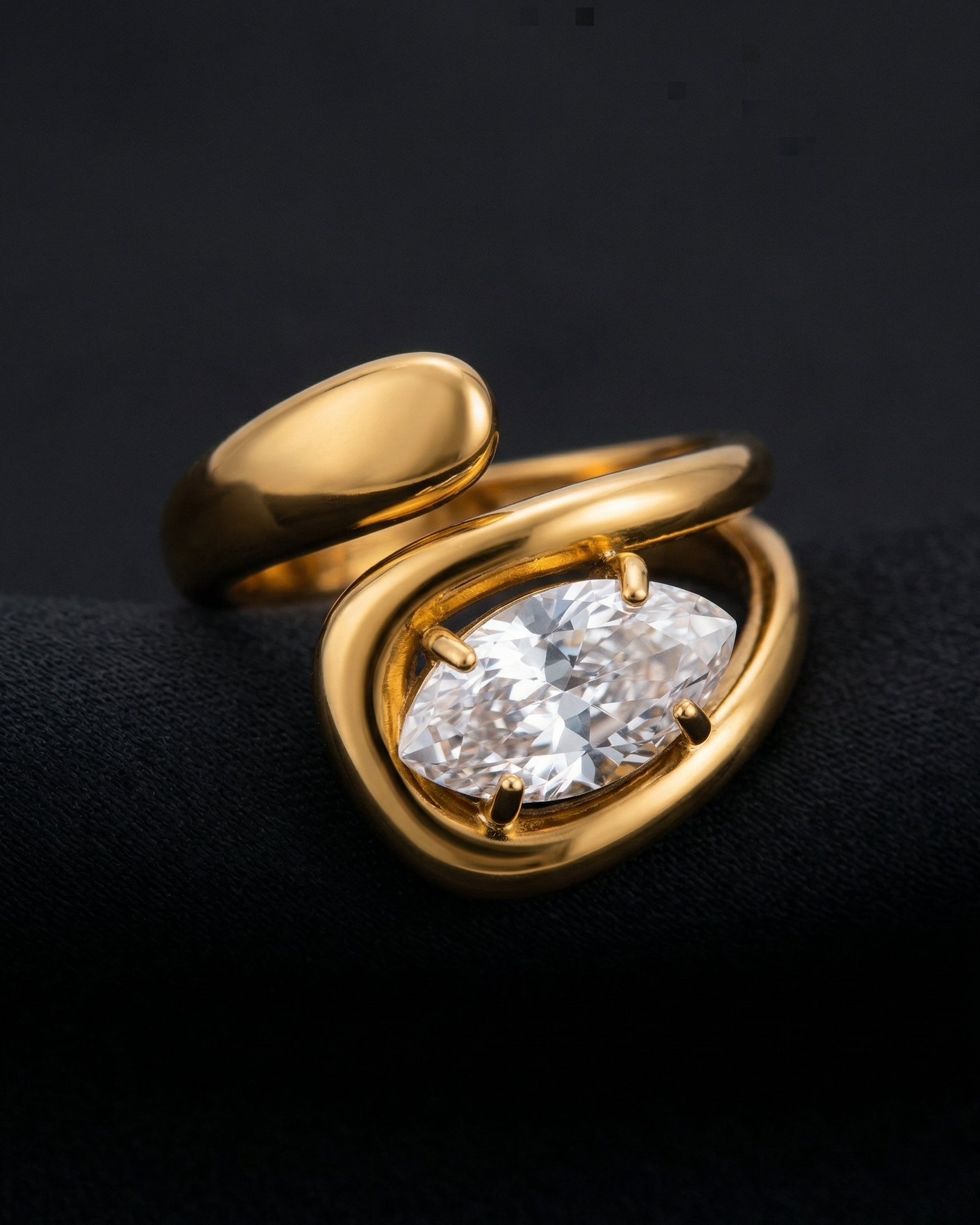 Gold ring with a large diamond on a black background