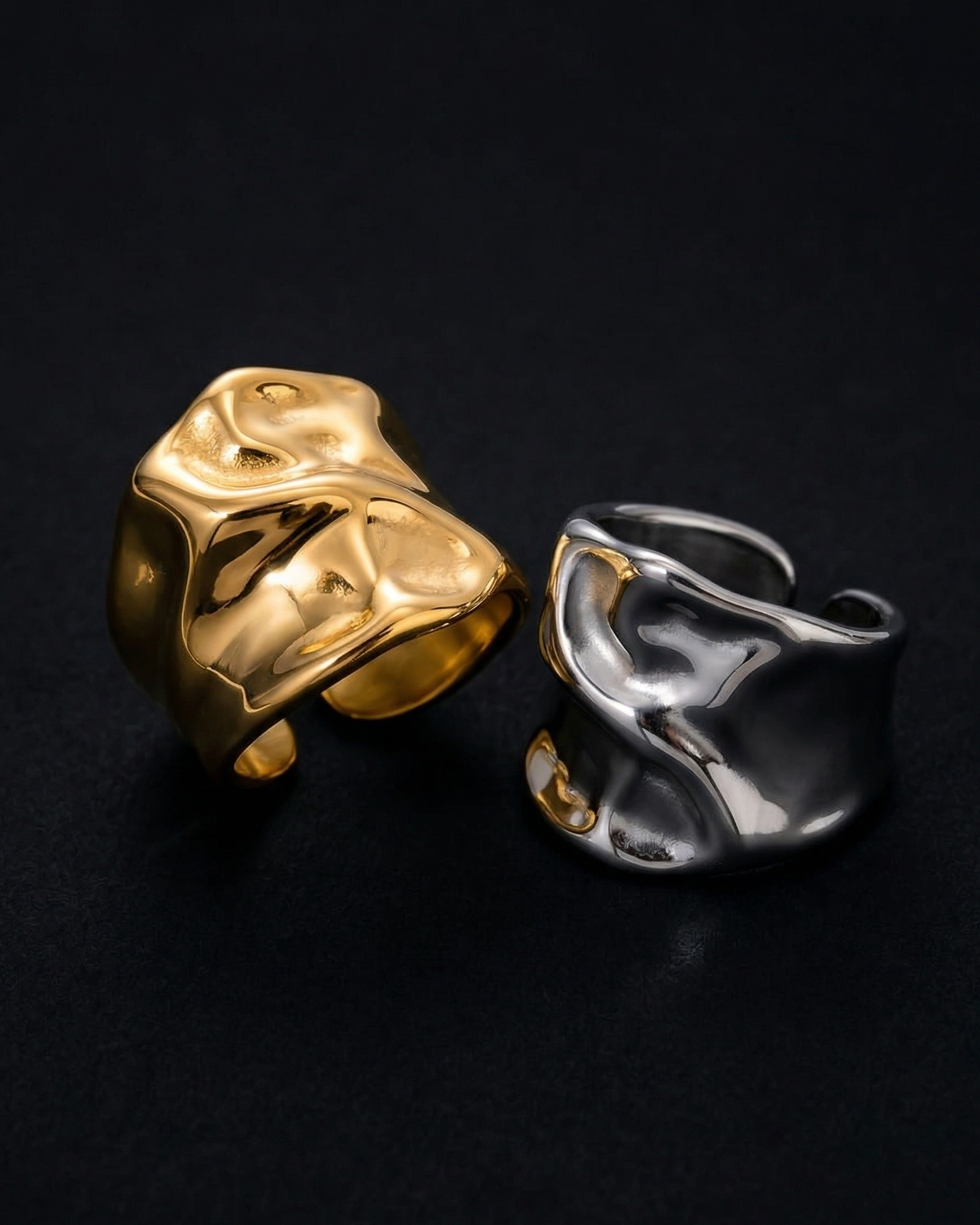 Gold and silver rings on a black background