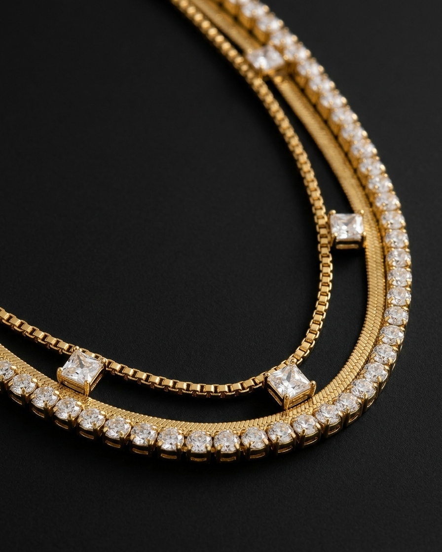 Gold bracelet with diamond accents on a black background