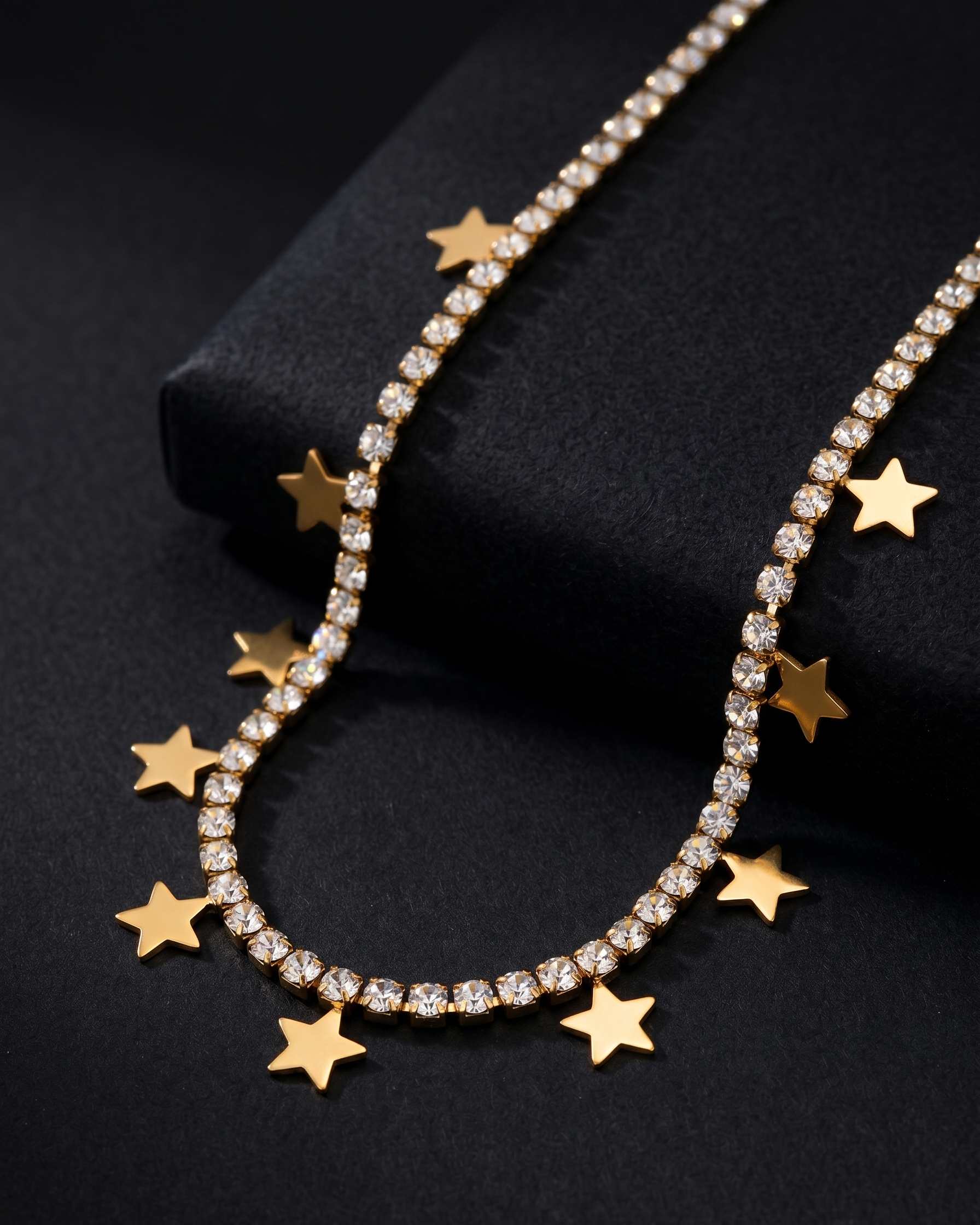 Necklace with star-shaped pendants on a black background