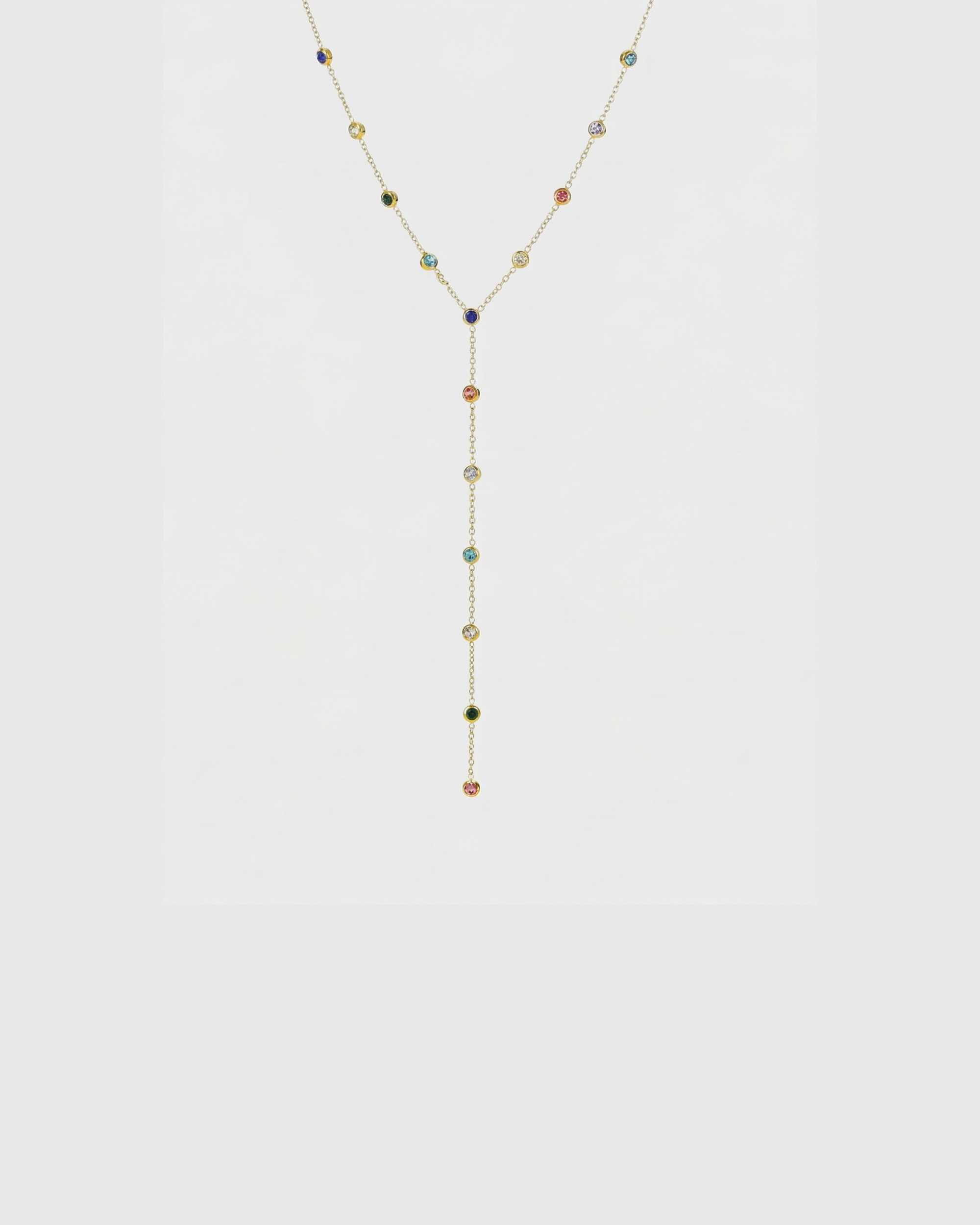 Necklace with multicolored beads on a light gray background