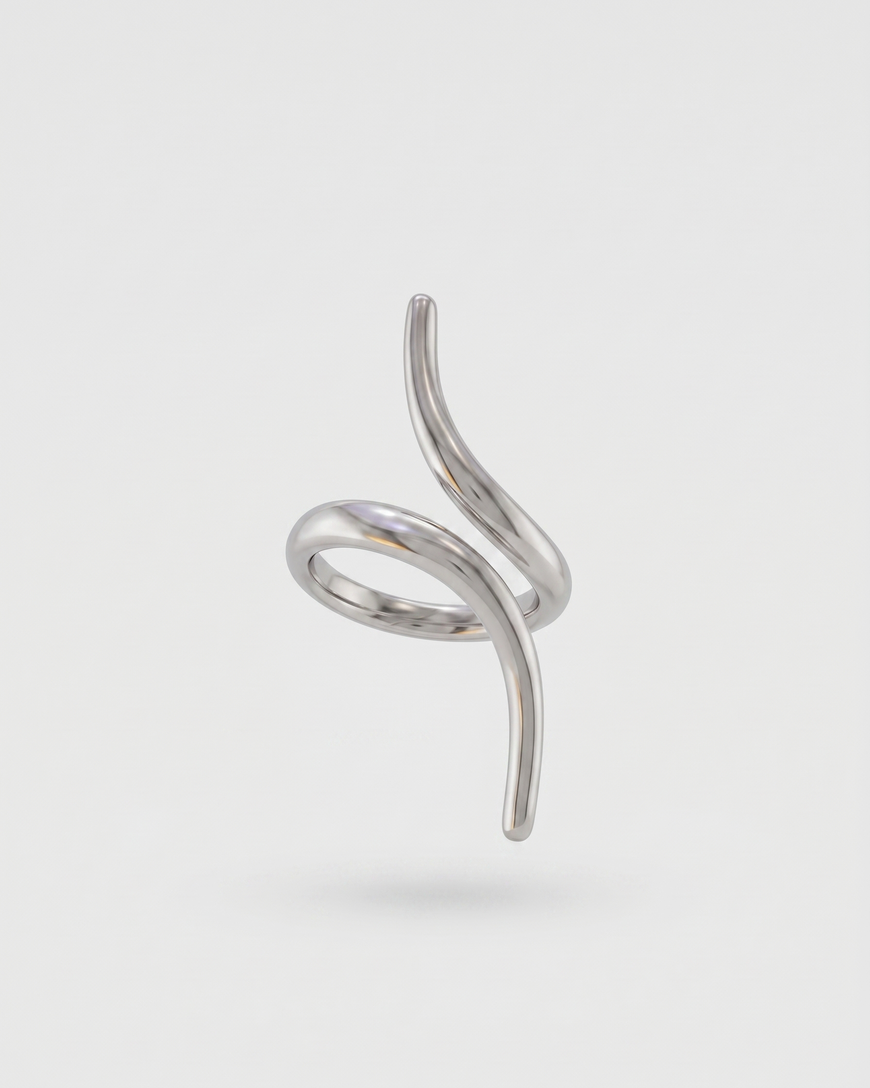 Silver spiral ring on a light gray background