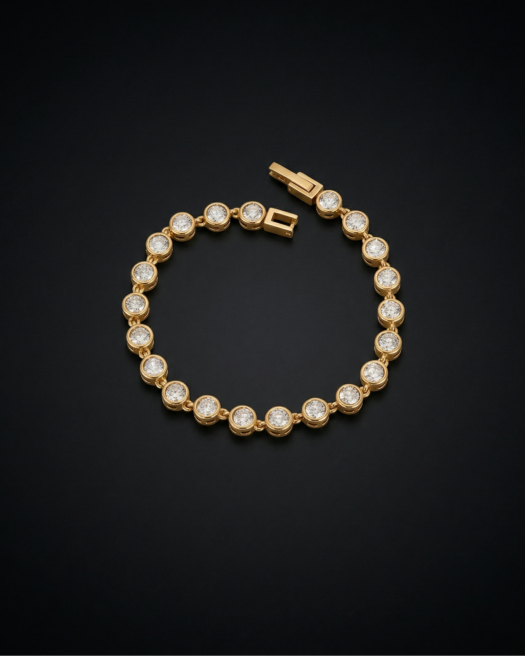 Gold bracelet with clear stones on a black background