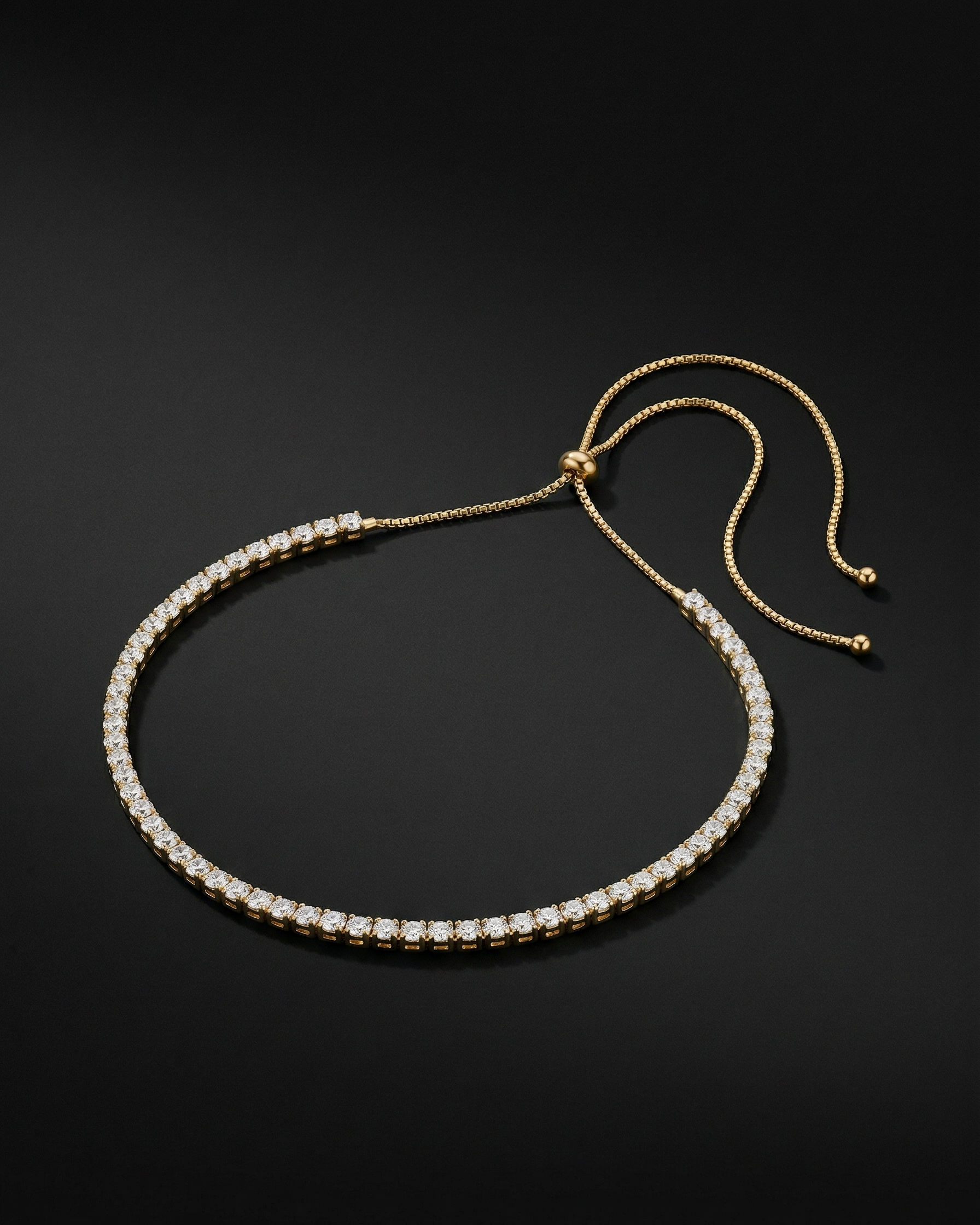 Gold and diamond bracelet on a black background