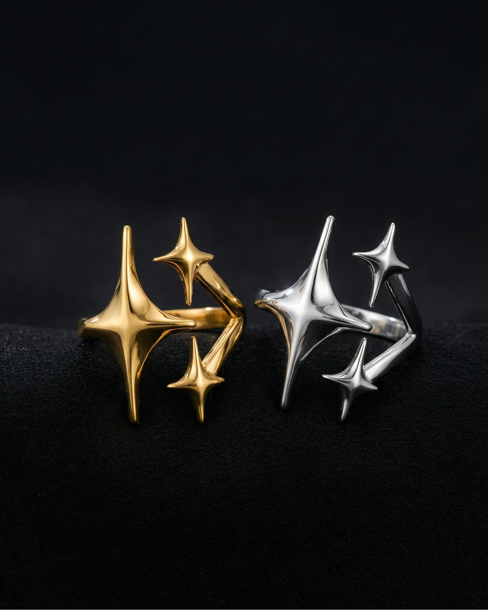 Gold and silver spike-shaped earrings on a black background