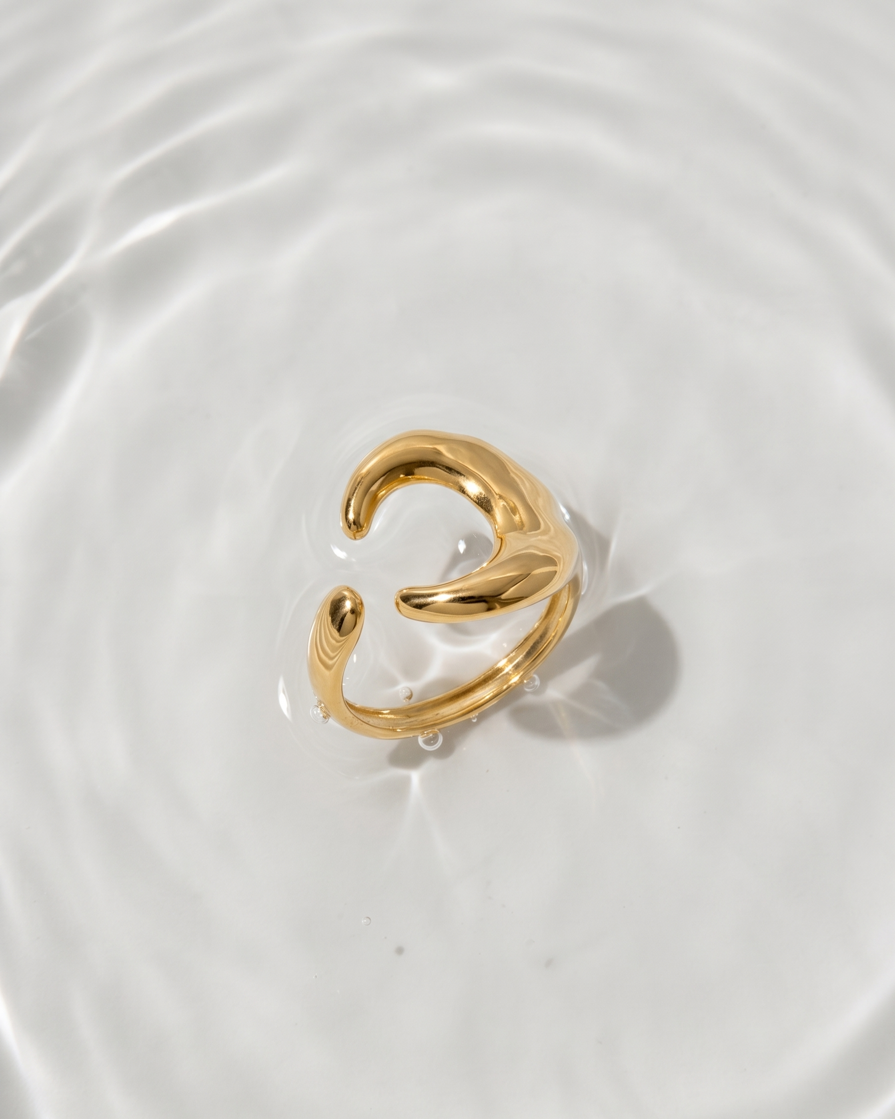 Gold ring on a water surface