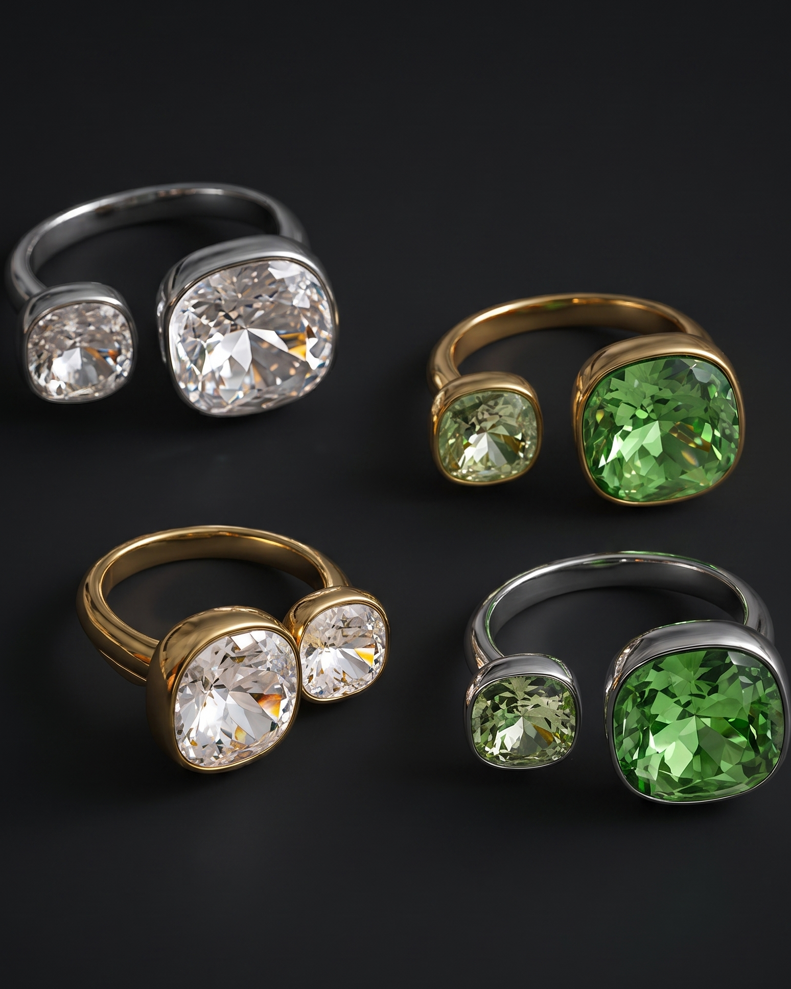 Four adjustable split-shank rings displayed on a dark background, featuring clear stones in silver settings, green stones in gold settings, and green stones in silver settings.