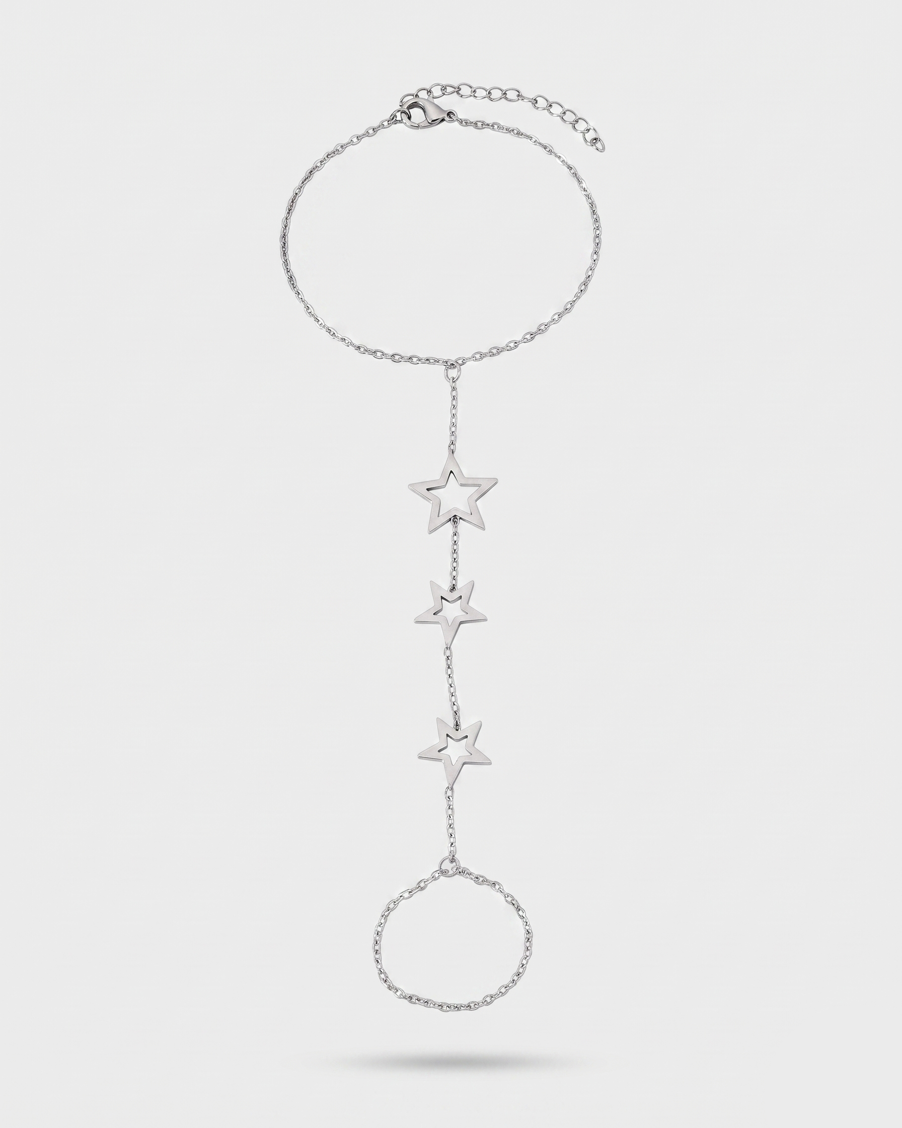 Silver star-shaped bracelet on a light gray background