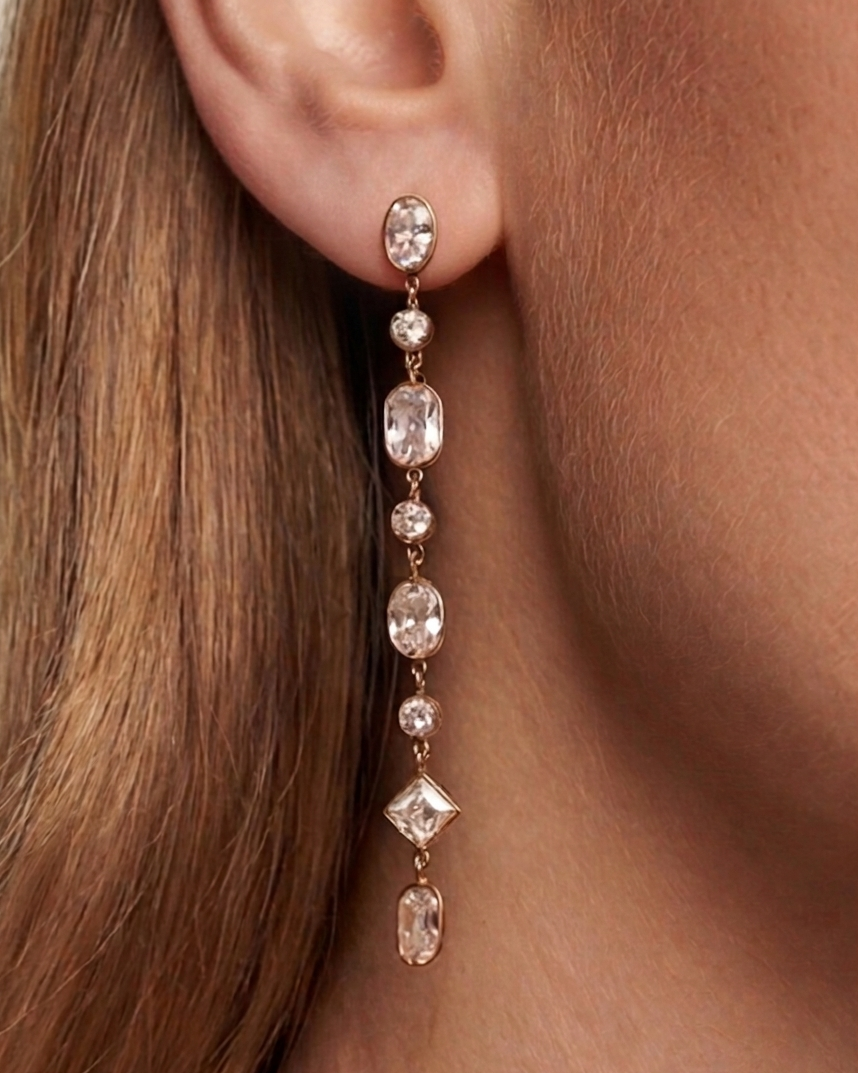 Earring worn by a person with brown hair, close-up view.