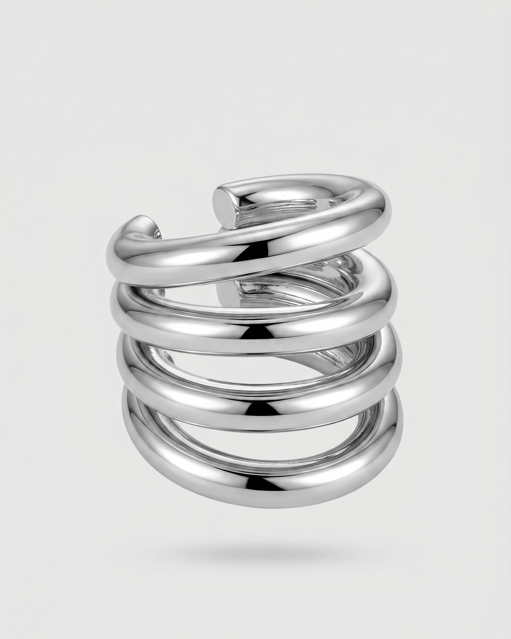 Silver spiral ring on a light gray background