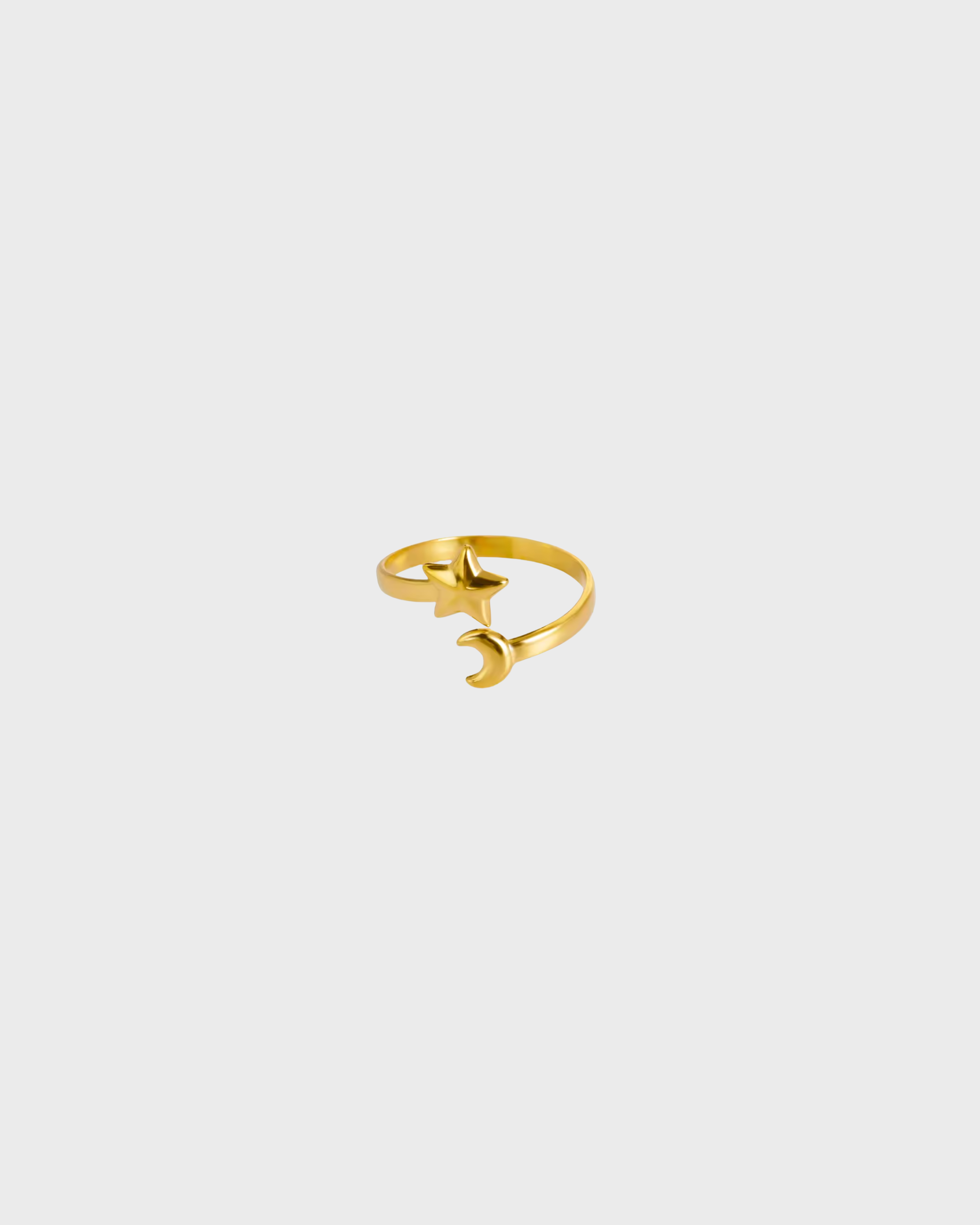 Gold ring with a unique design on a light gray background