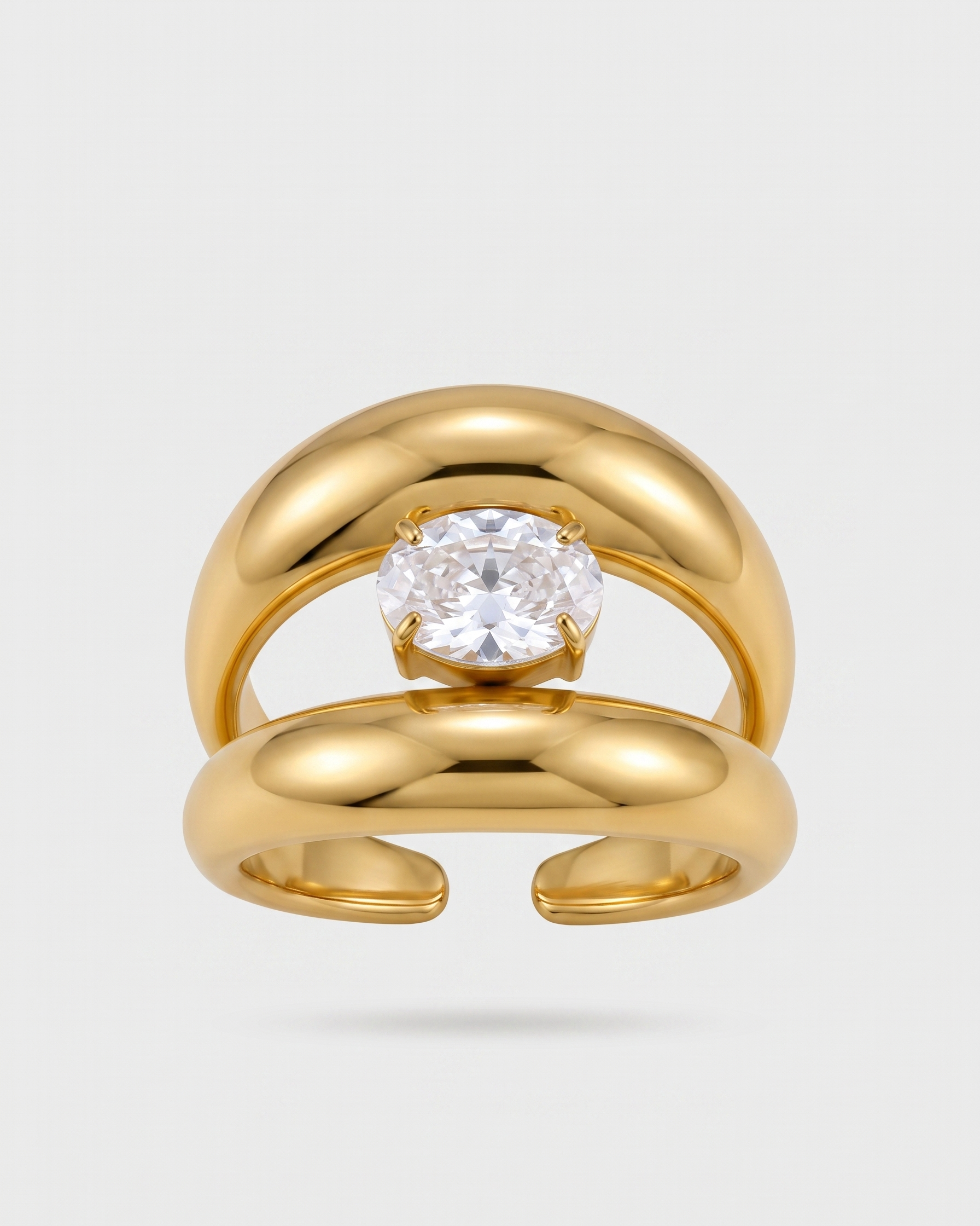 Gold ring with a diamond on a light gray background