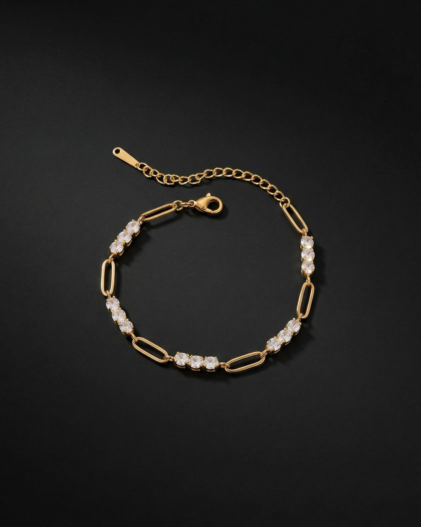 Gold bracelet with pearl-like beads on a black background