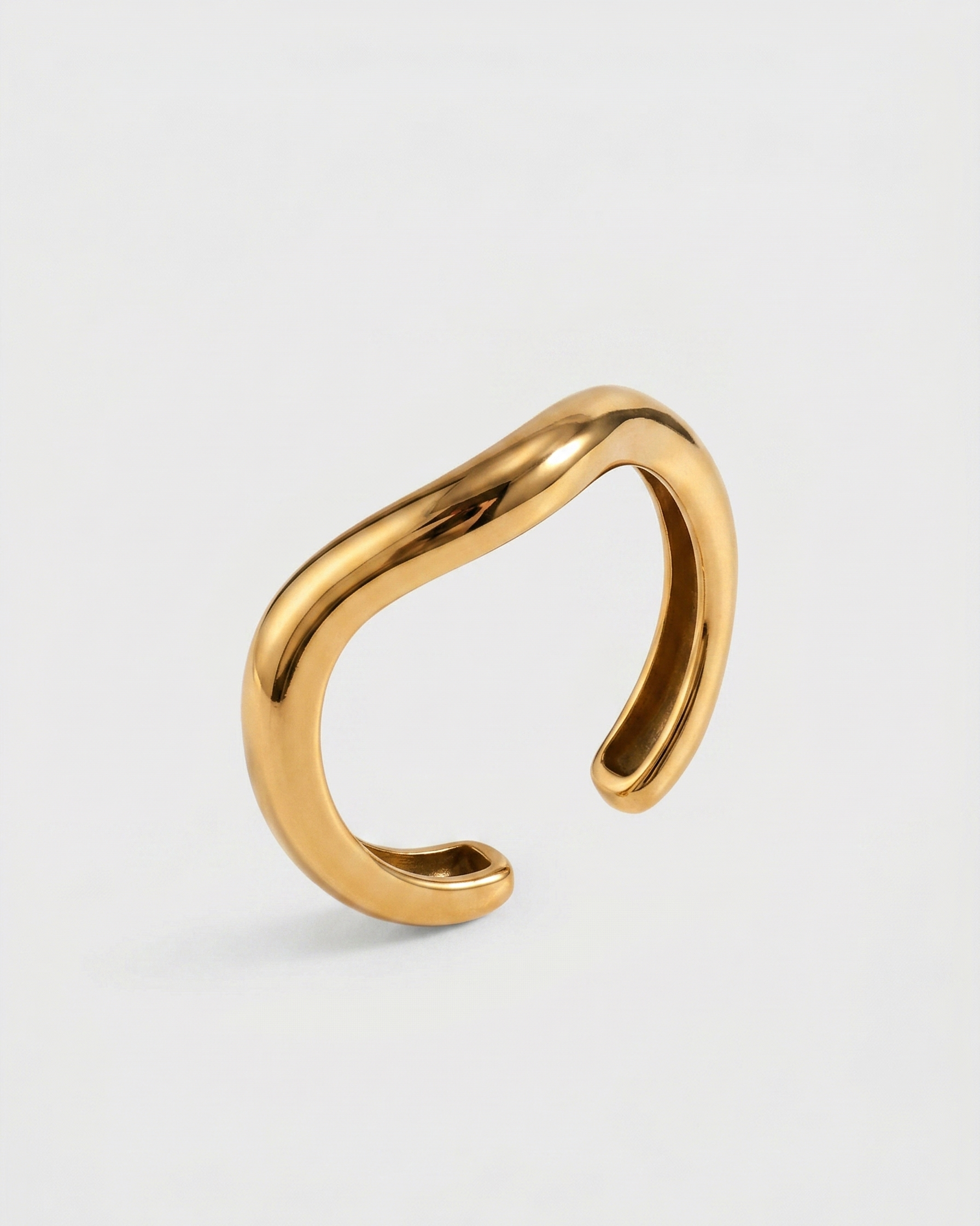 Gold ring on a white background