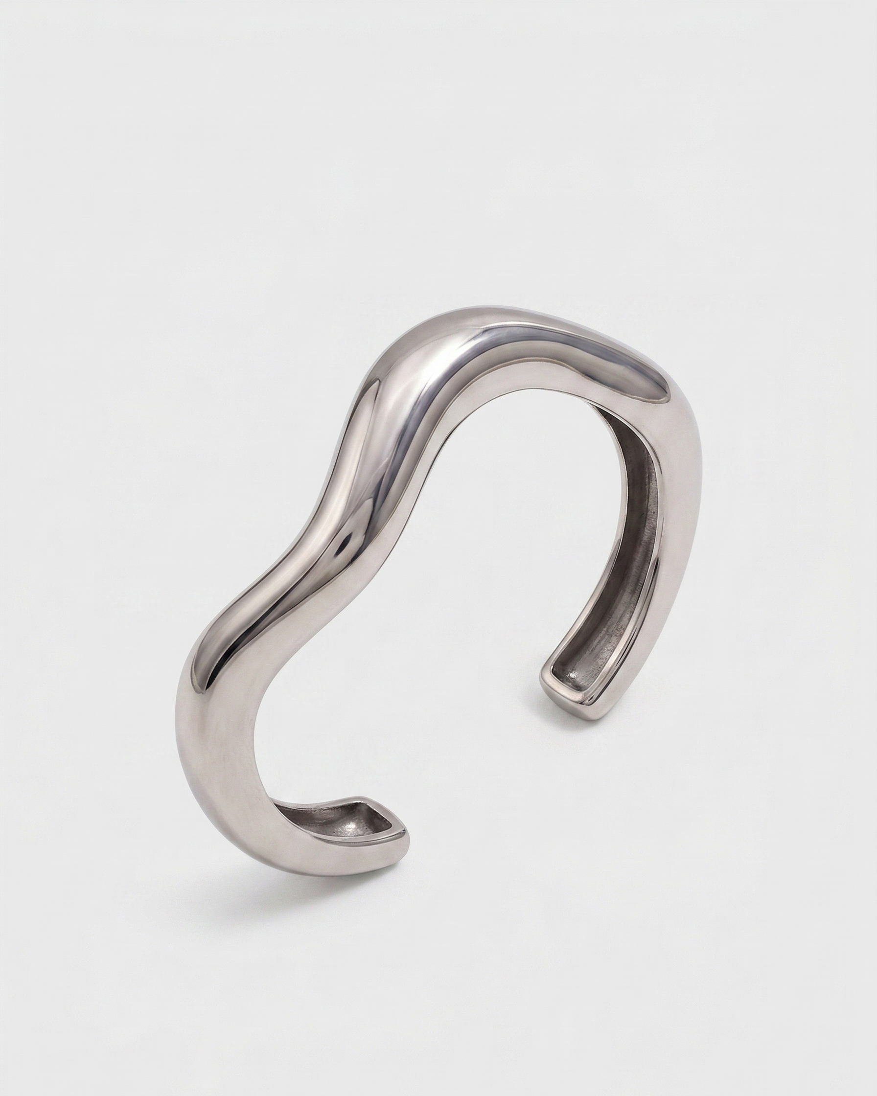 Silver ear cuff on a white background