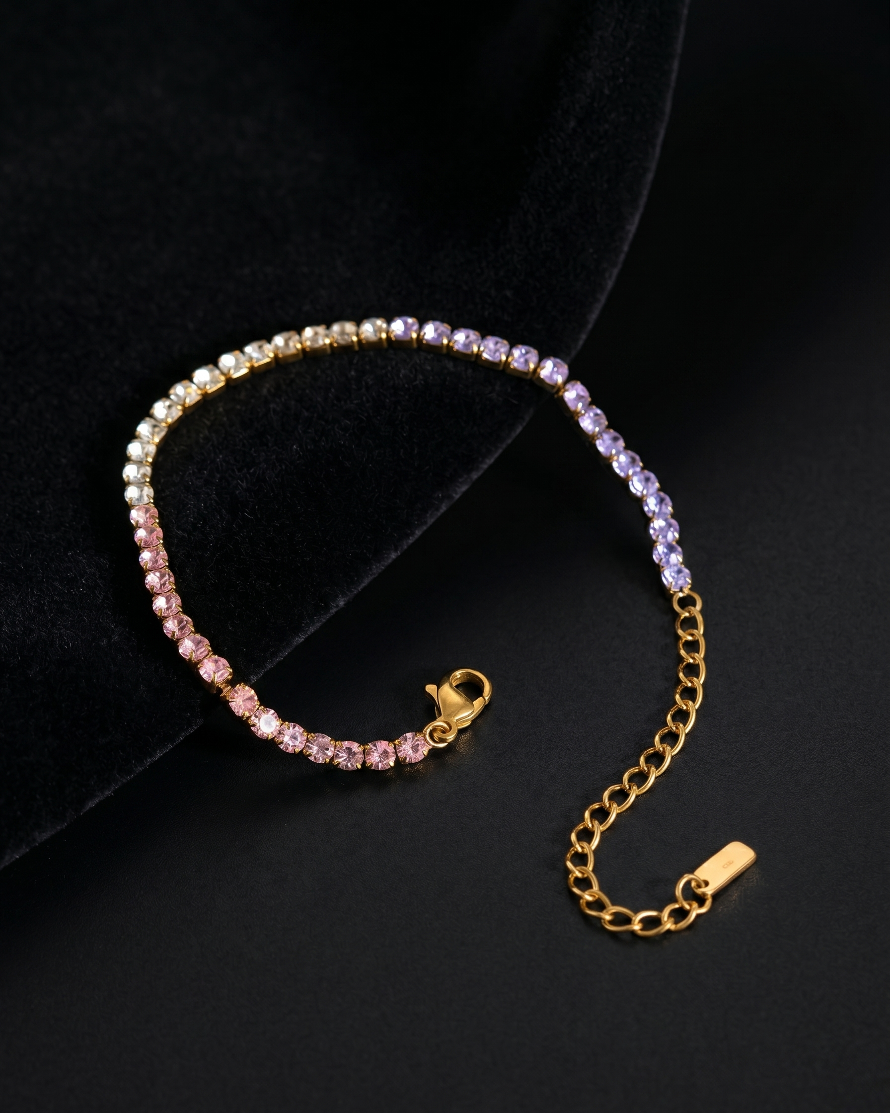 Bracelet with pink and purple stones on a black background