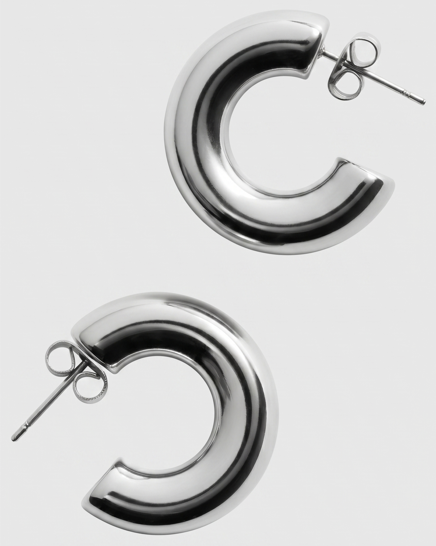 Silver hoop earrings on a white background
