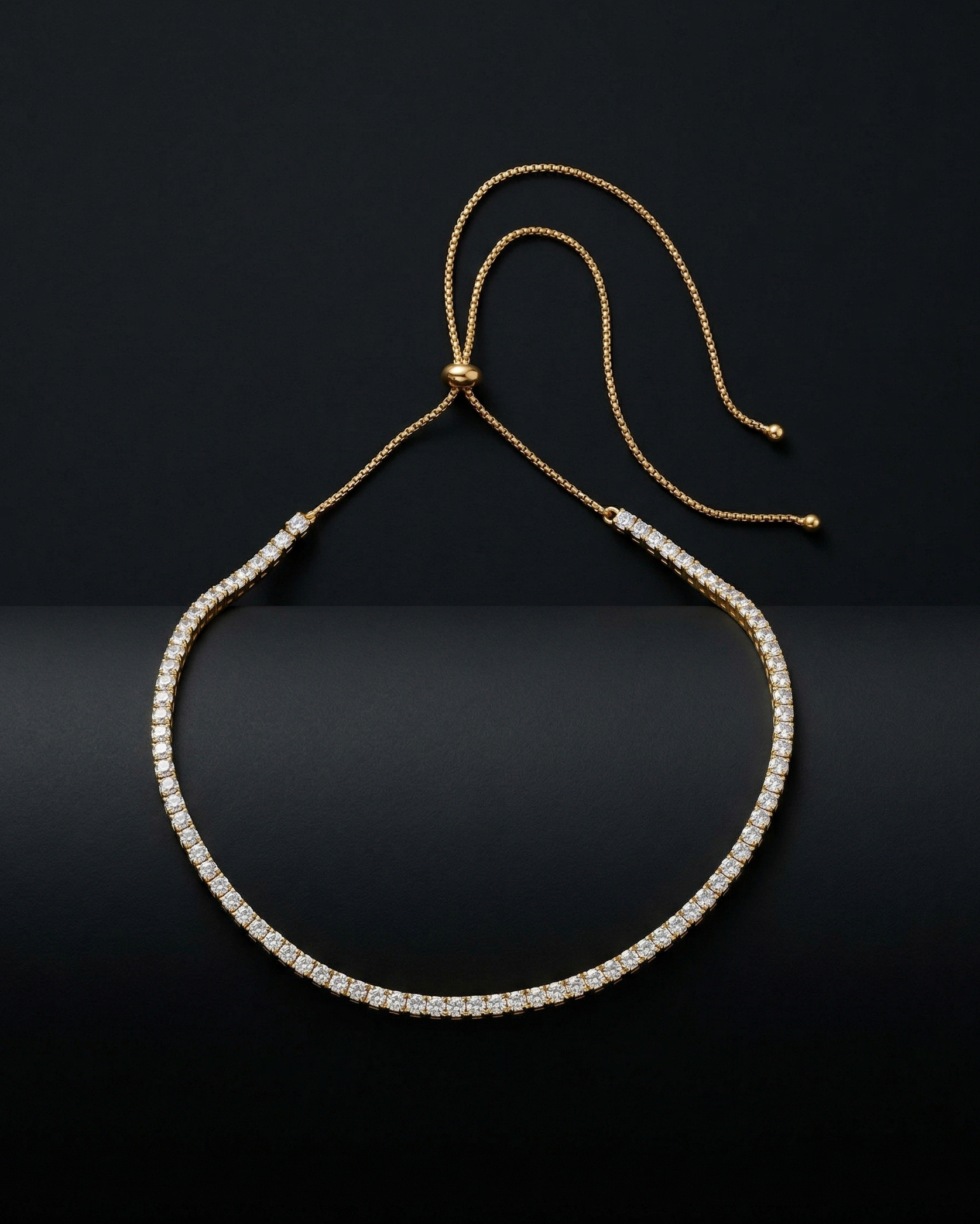 Gold bracelet with small beads on a black background