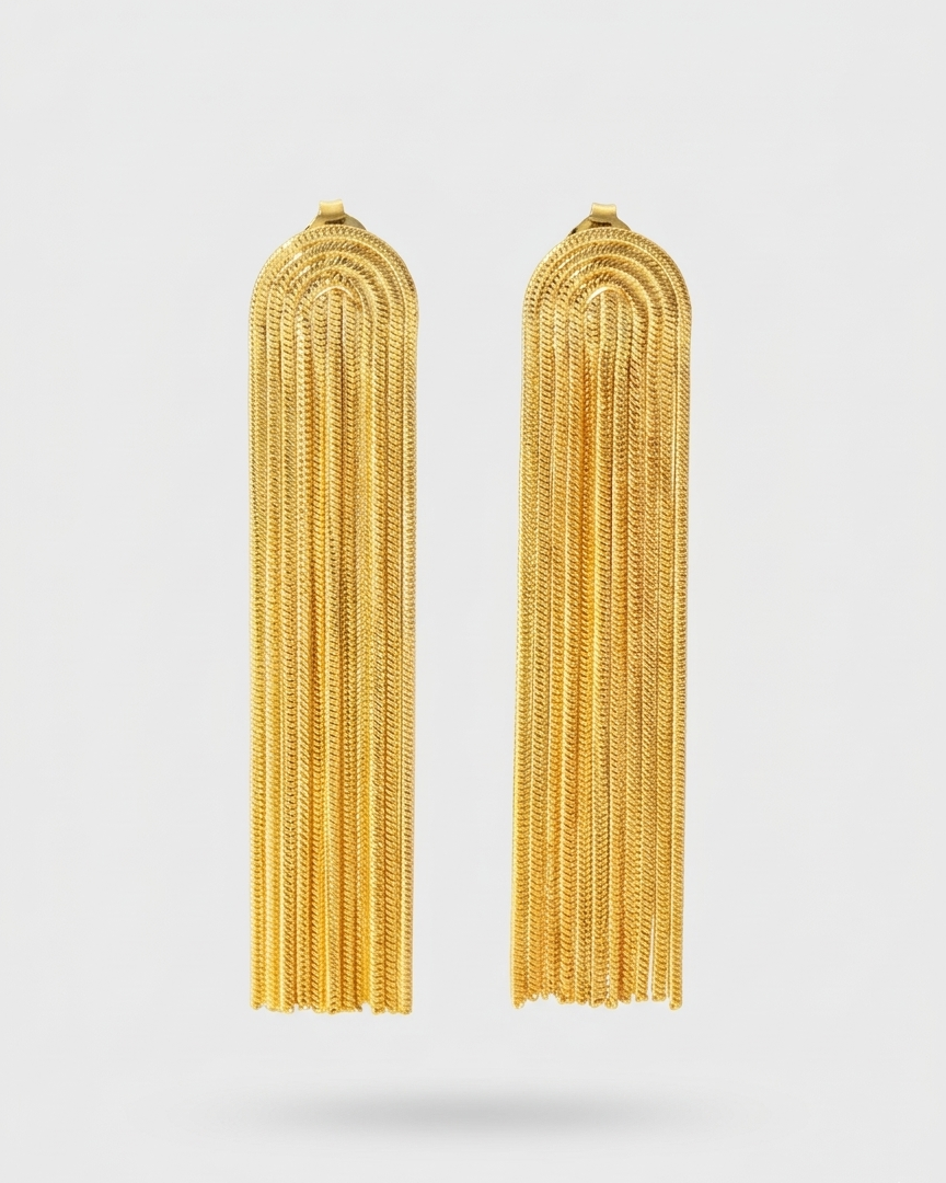 Pair of gold tassel earrings on a white background