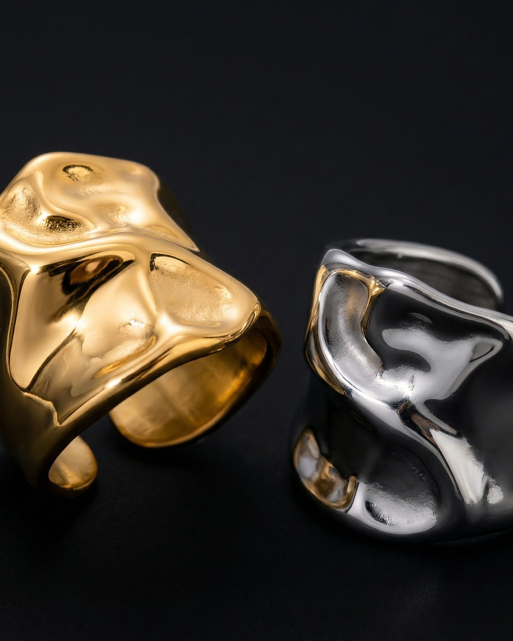 Gold and silver rings on a black background