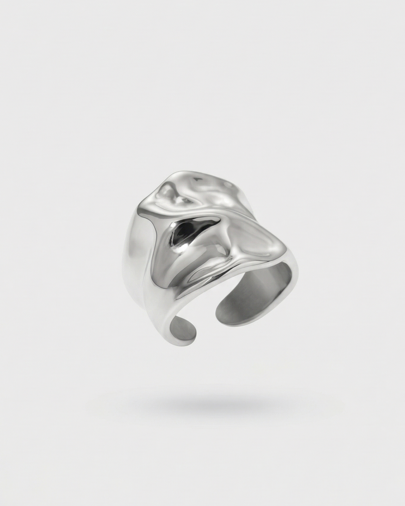Silver ring on a light gray background