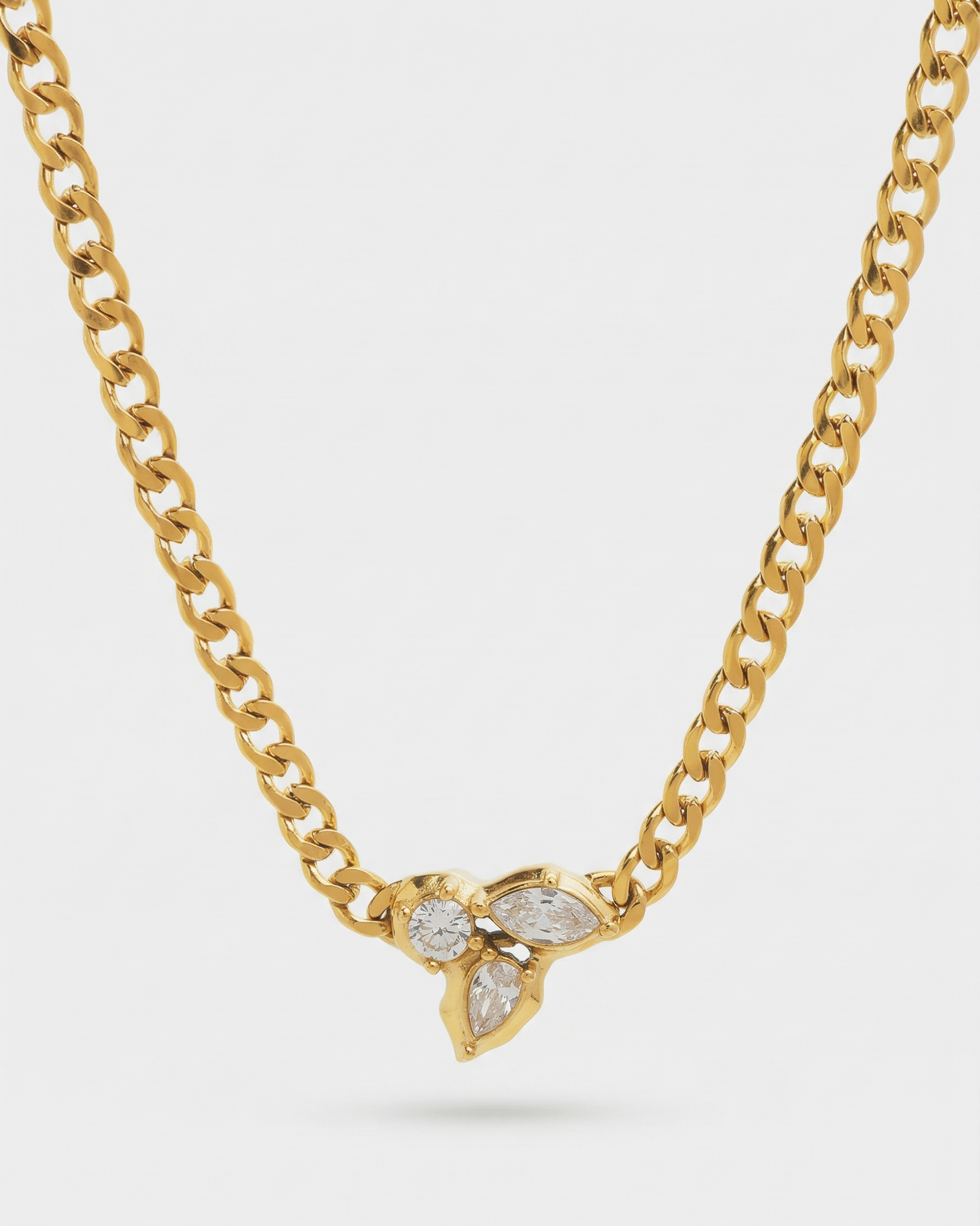 Gold necklace with a butterfly pendant on a white background