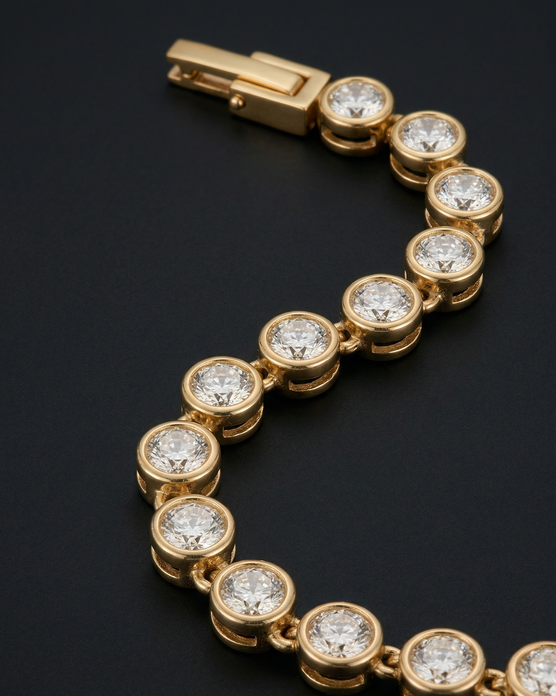Gold bracelet with diamond accents on a black background