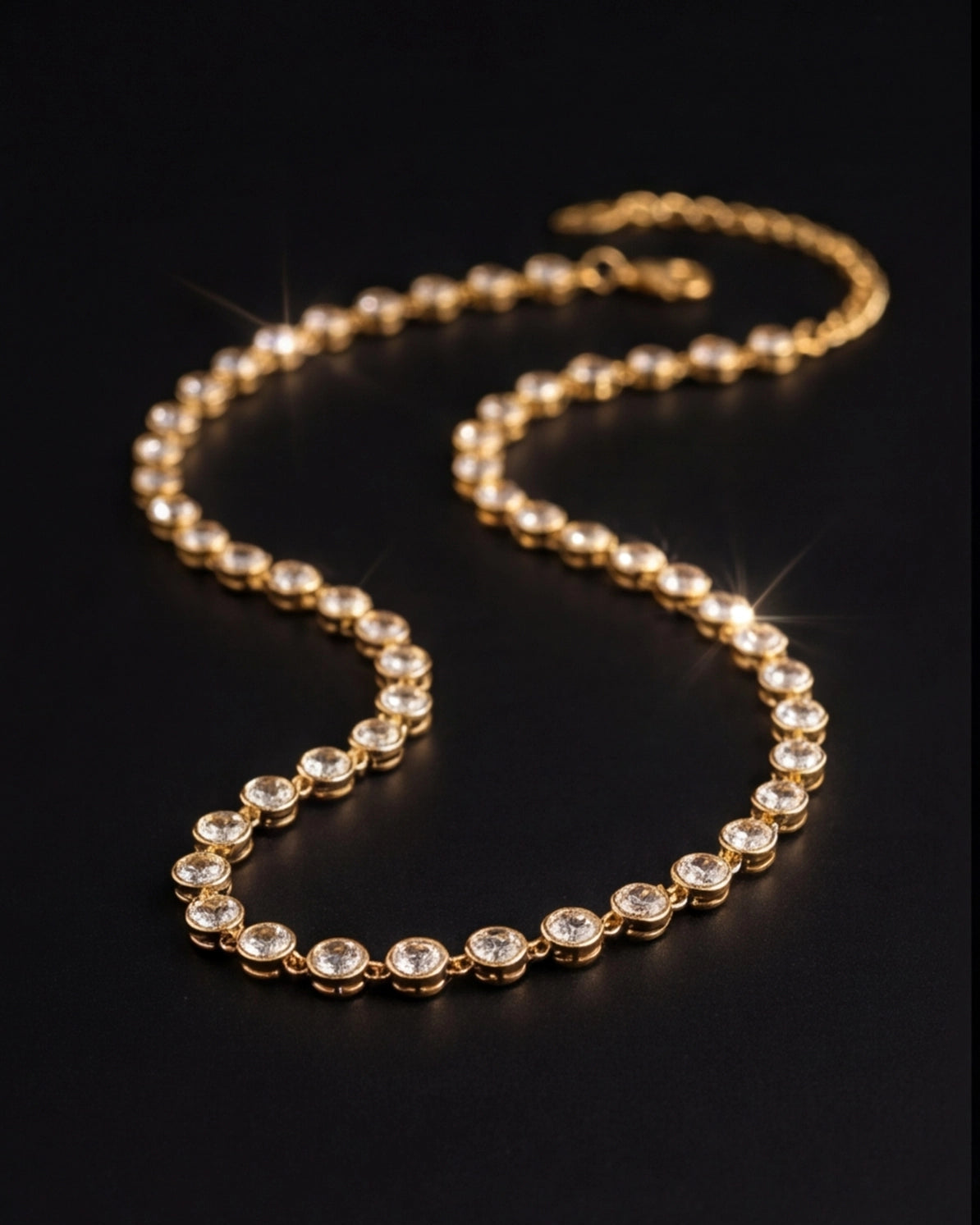 Gold necklace with embedded crystals on a black background