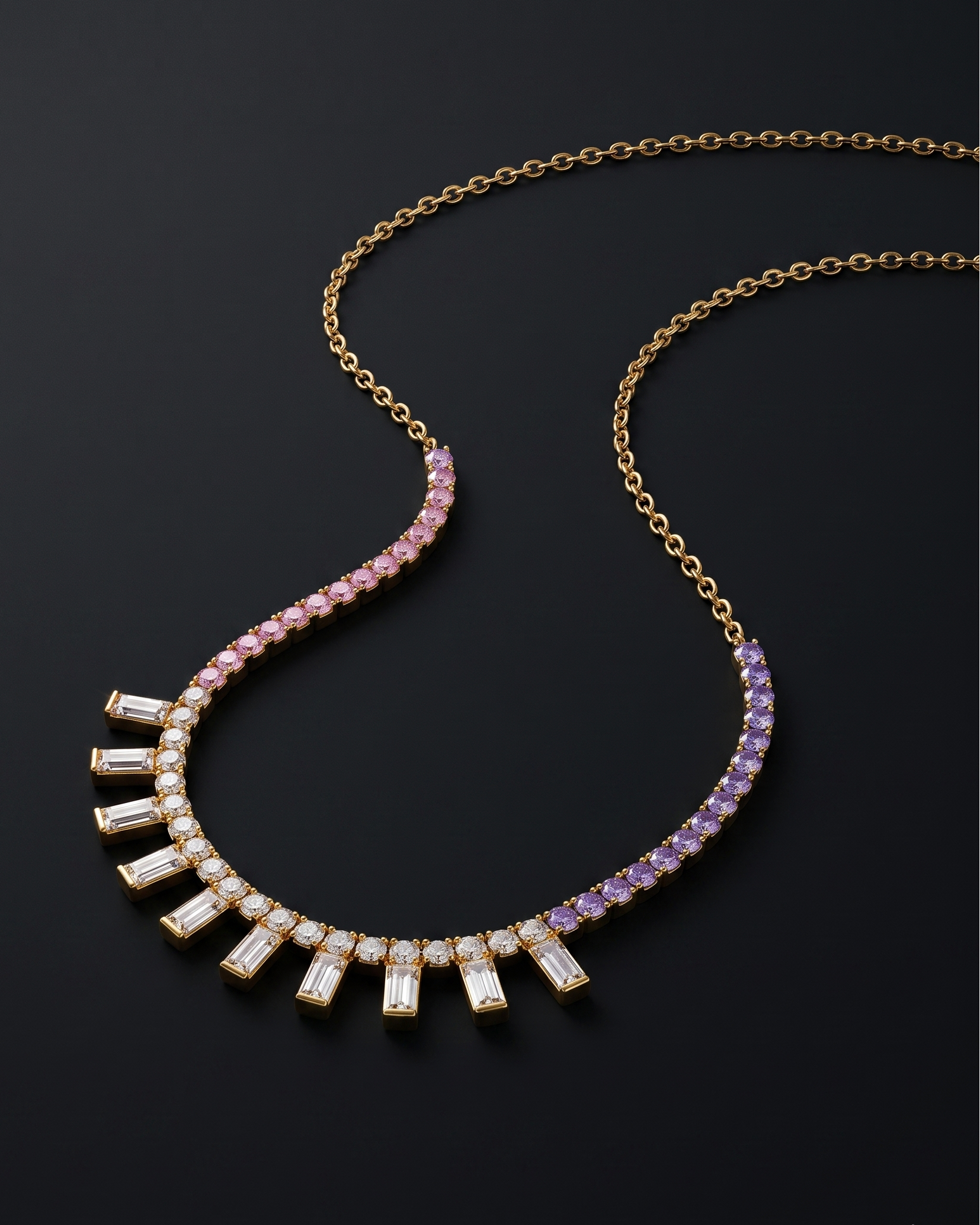 Necklace with pink and purple gemstones on a dark background