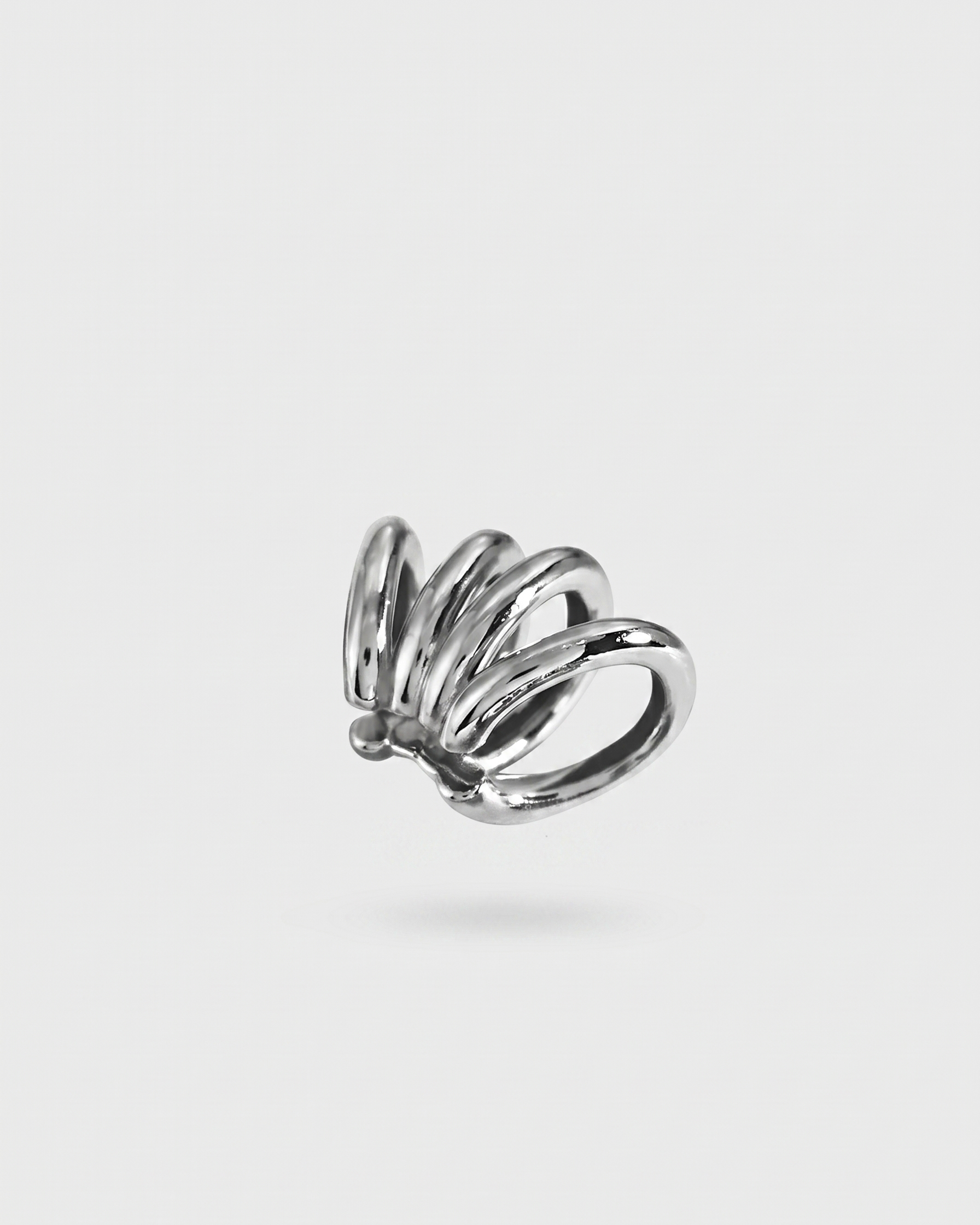 Silver ring with a unique design on a white background