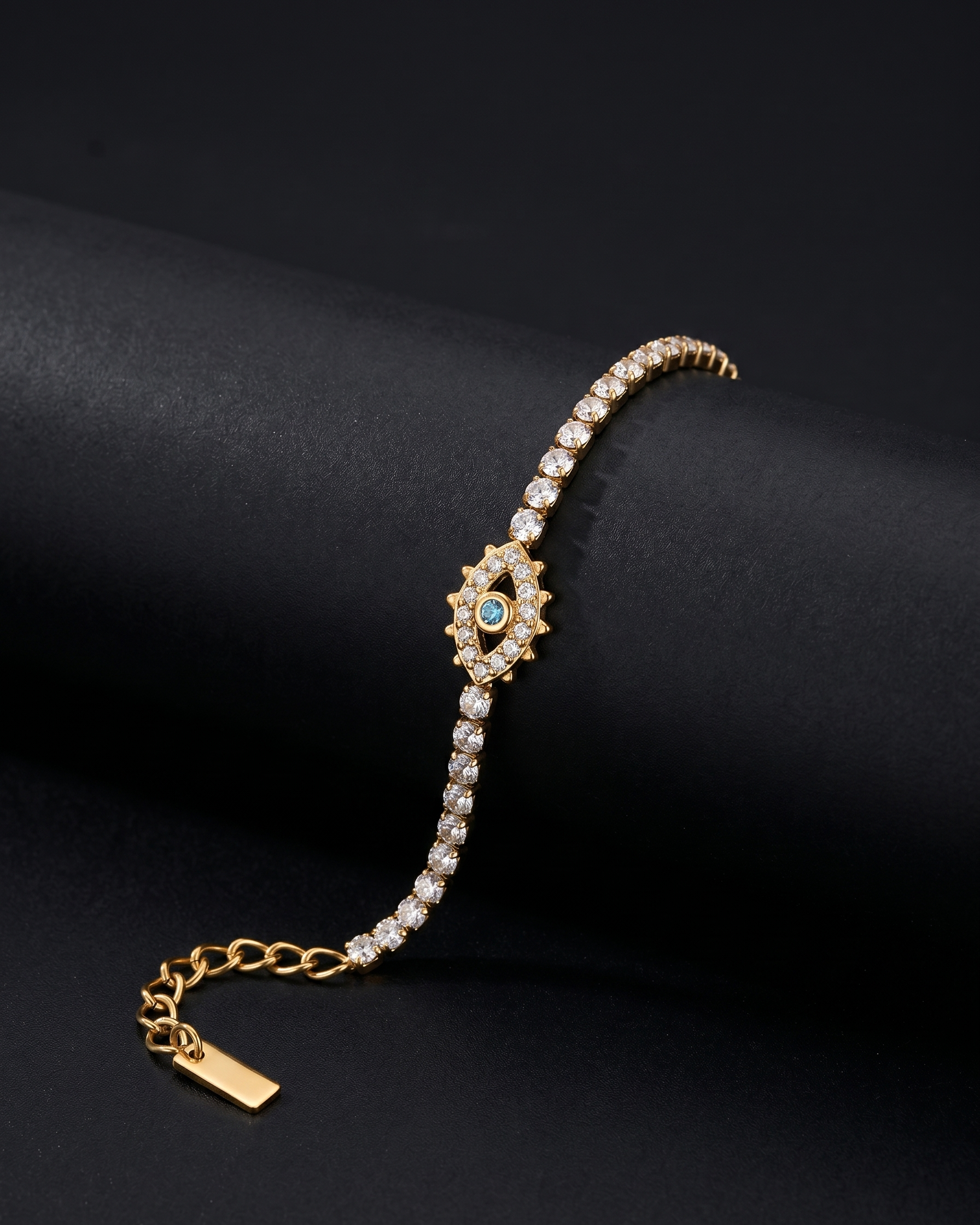 Gold bracelet with gemstones on a black background