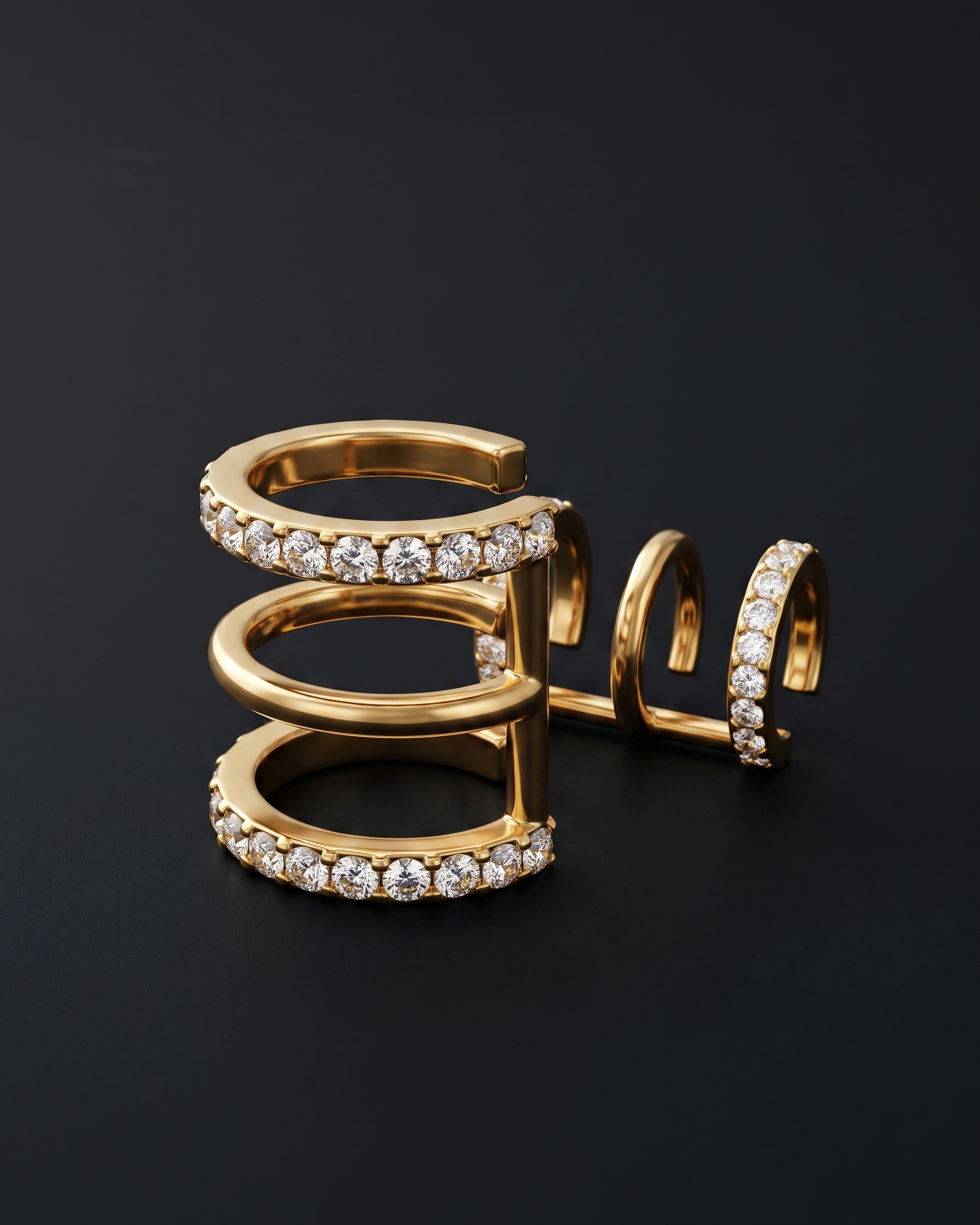 Gold spiral earring with embedded diamonds on a black background