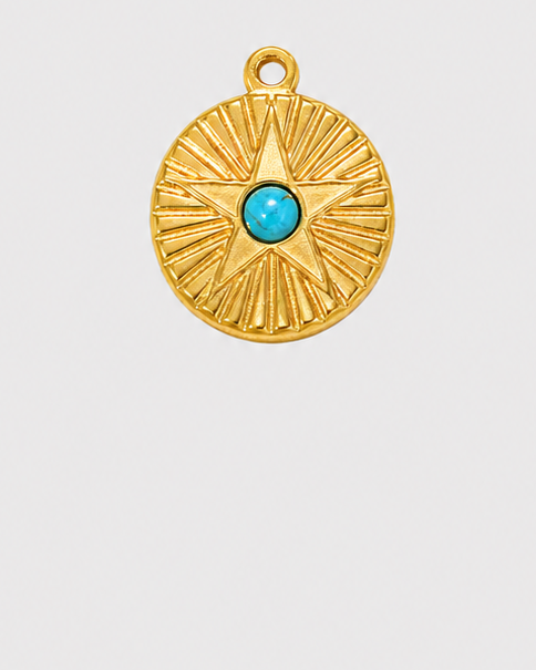 A gold circular pendant with a sunburst textured design and a small central turquoise blue stone, shown against a light gray background.