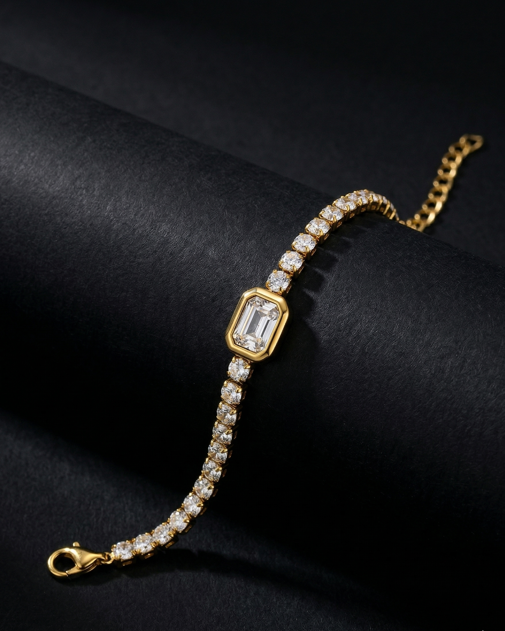 Gold bracelet with diamond accents on a black background
