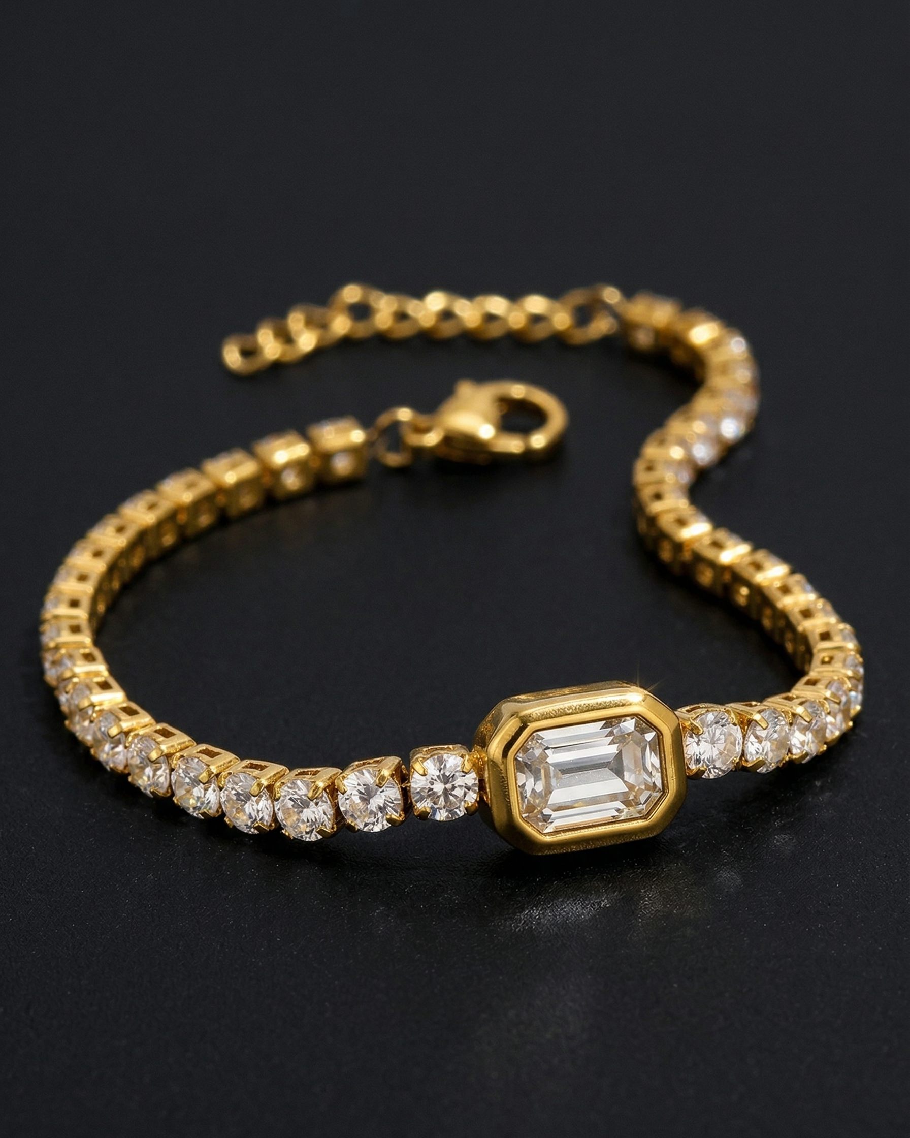 Gold bracelet with diamond accents on a dark background