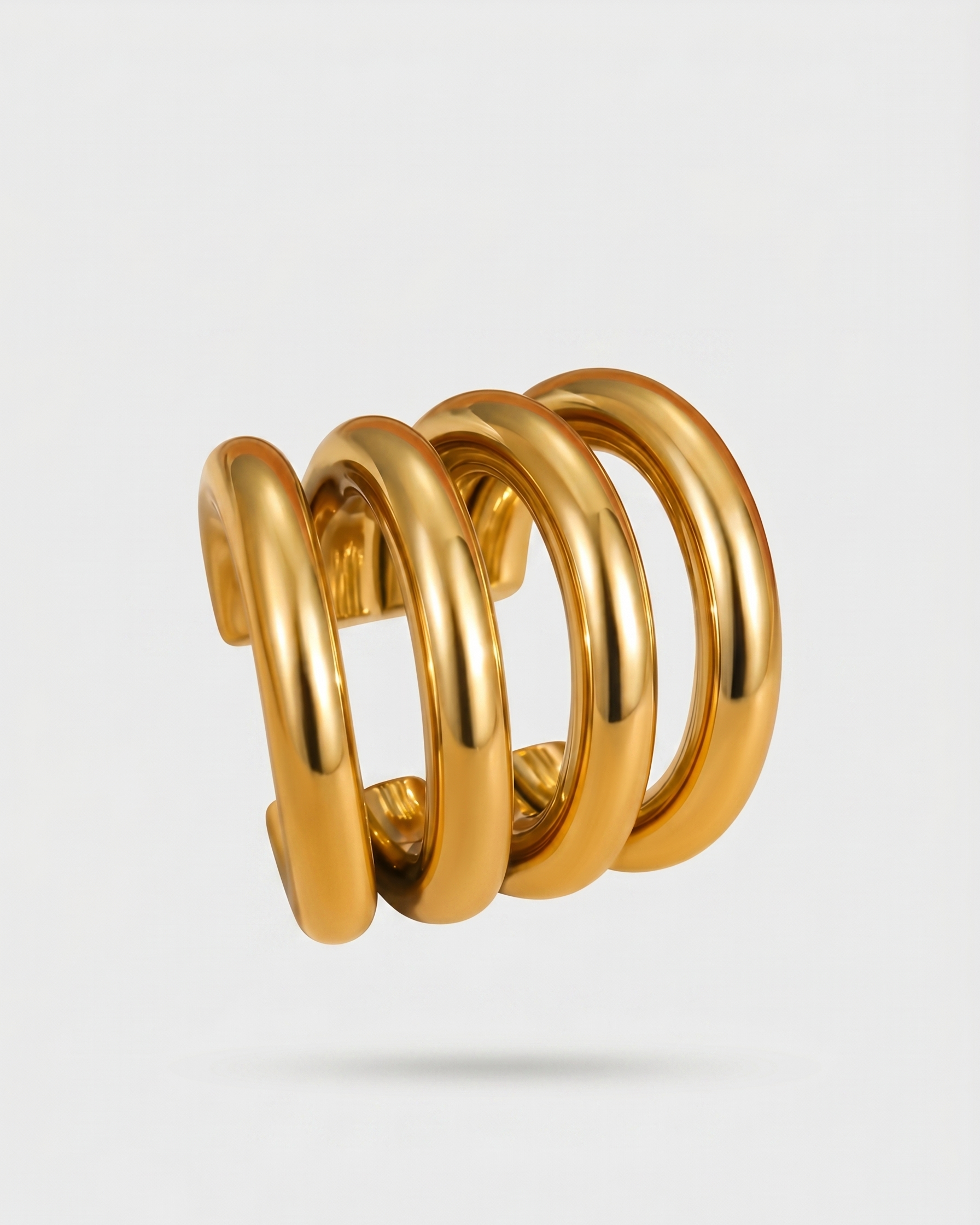 Gold spiral spring on a light gray background